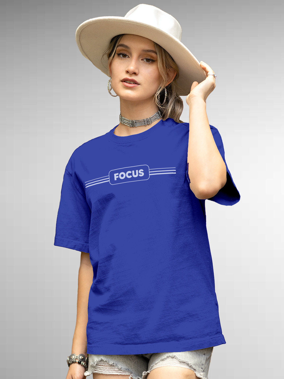 Model wearing Women's Blue Round Neck T-shirt with 'Focus' design, offering effortless style and premium comfort