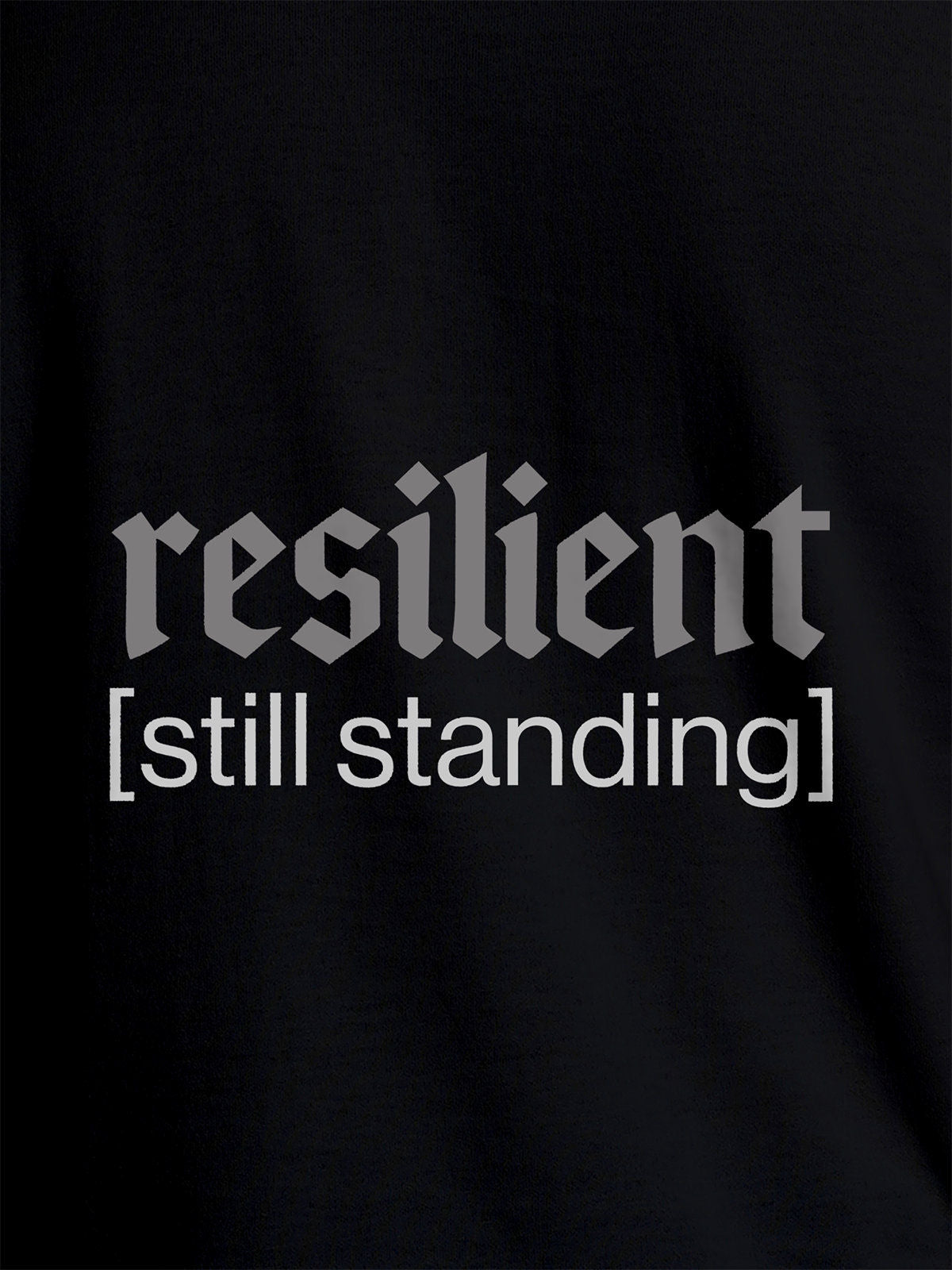 Close up of 'Resilient' design on Women's Black Round Neck T-shirt, highlighting intricate details and vibrant print.