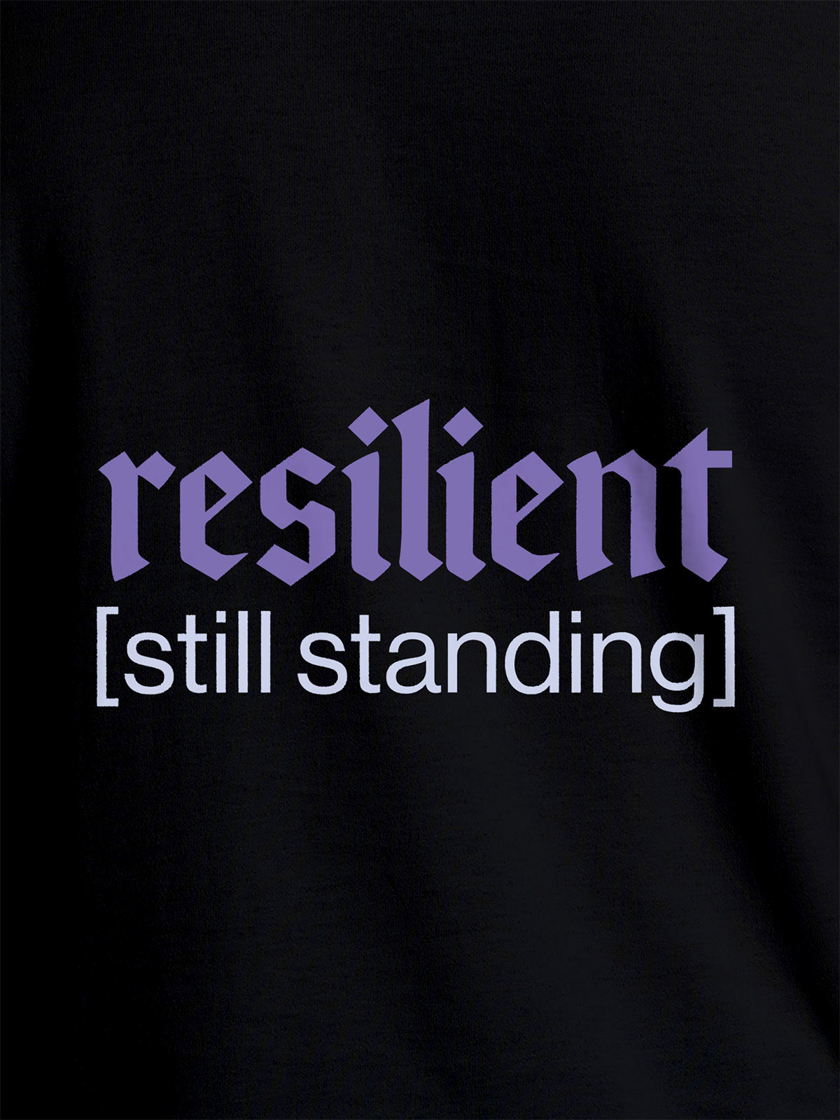 Close up of 'Resilient' design on Women's Black Round Neck T-shirt, highlighting intricate details and vibrant print.