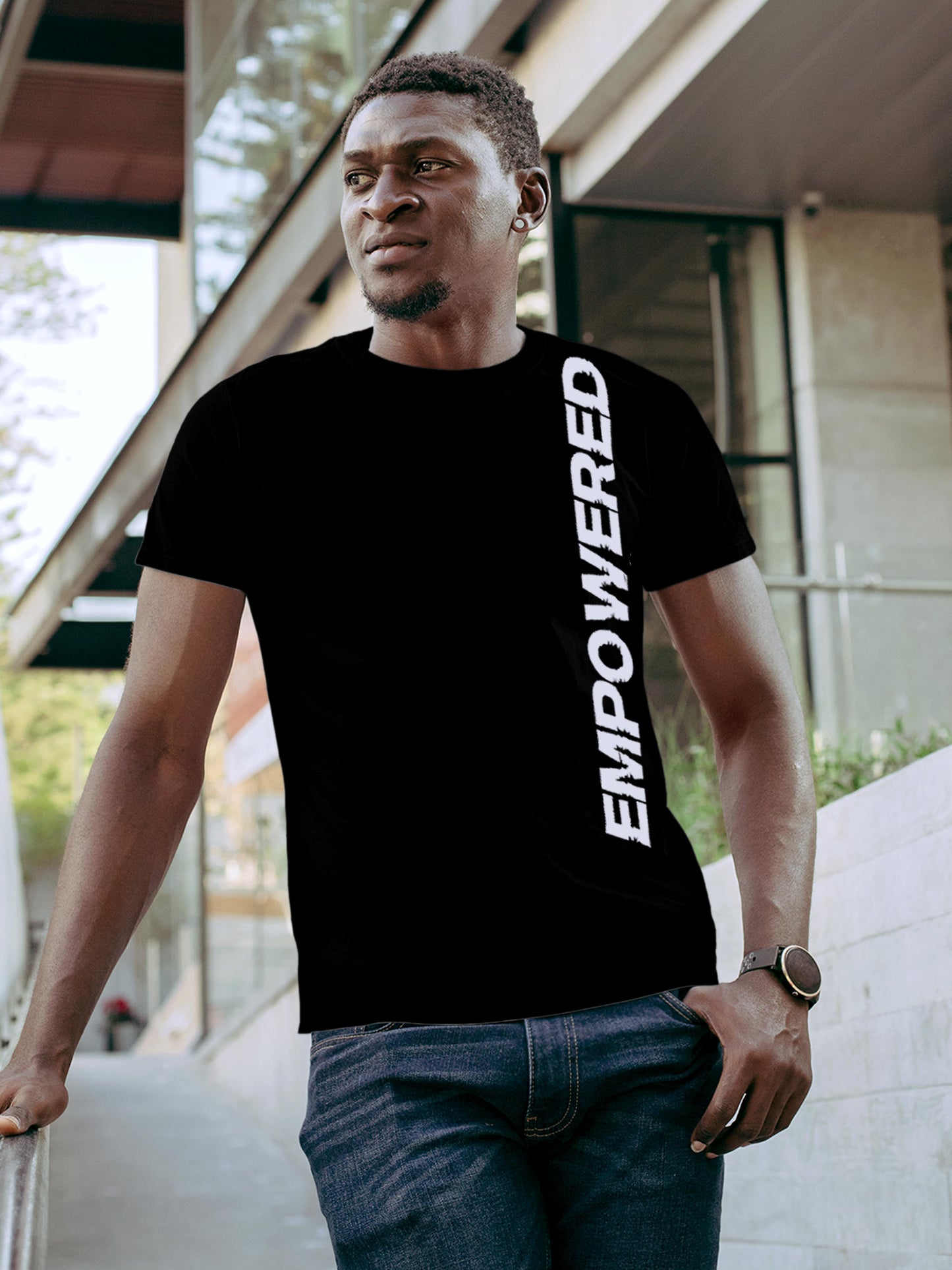 Model wearing Men's Black Round Neck T-shirt with 'Empowered' design, offering effortless style and premium comfort