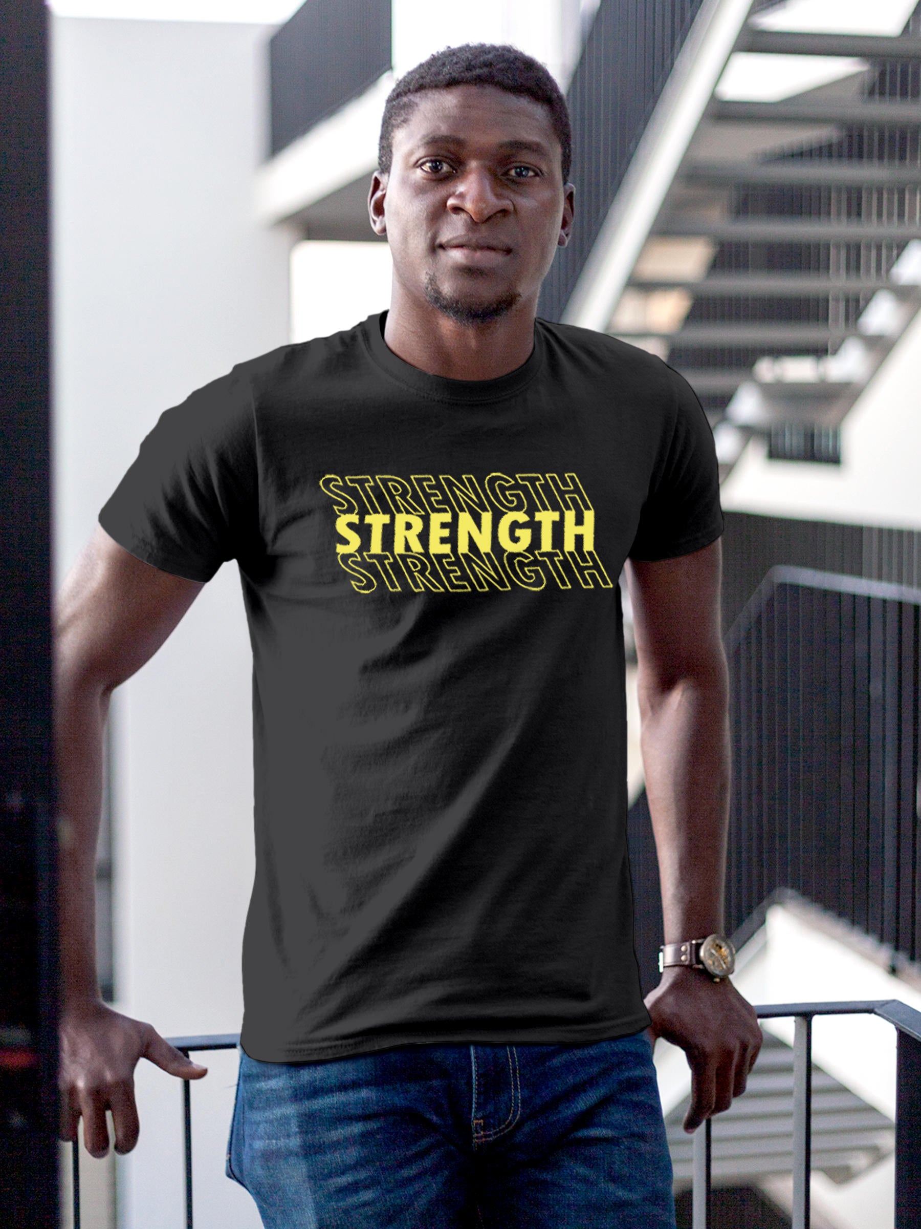Model wearing Men's Dark Grey Round Neck T-shirt with 'Strength' design, offering effortless style and premium comfort