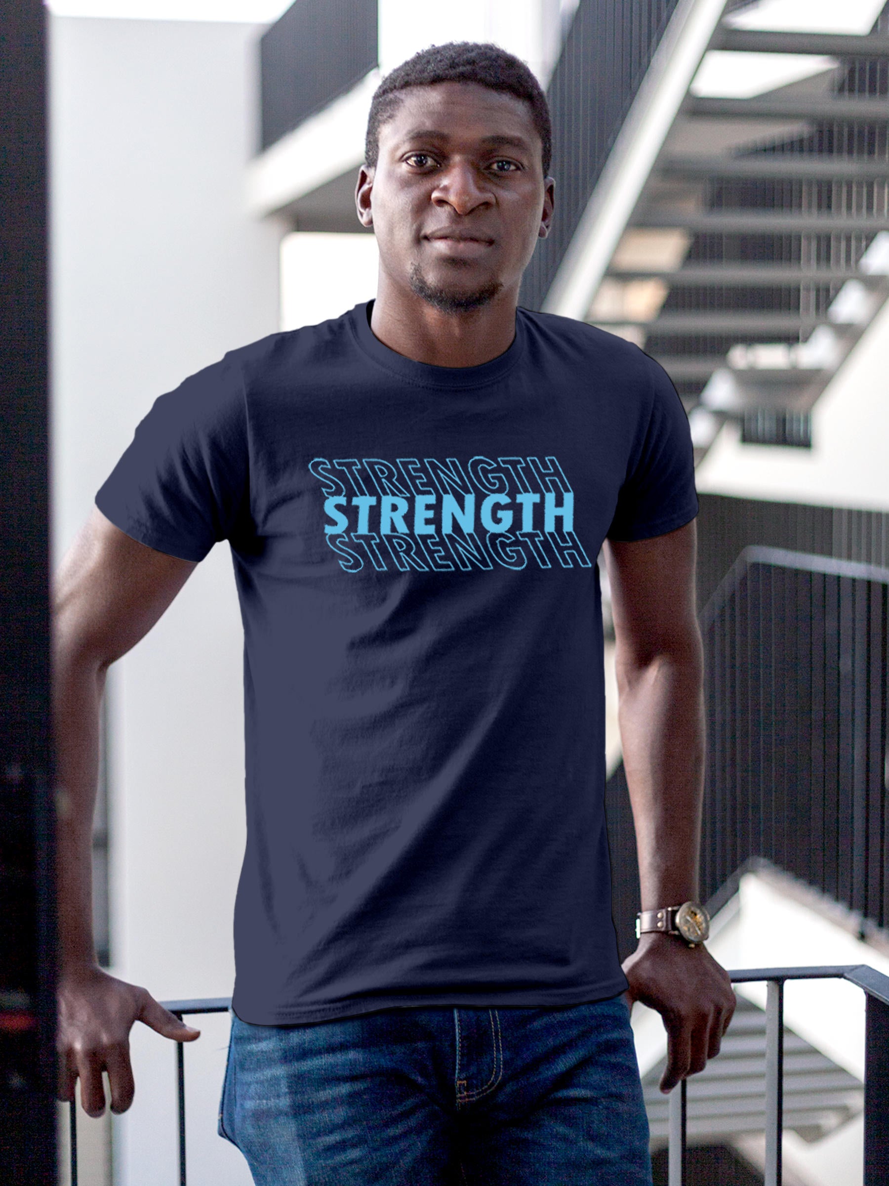 Model wearing Men's Navy Blue Round Neck T-shirt with 'Strength' design, offering effortless style and premium comfort