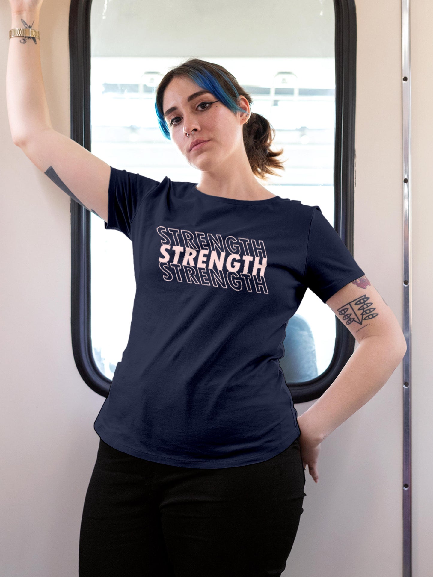 Model wearing Women's Navy Blue Round Neck T-shirt with 'Strength' design, offering effortless style and premium comfort