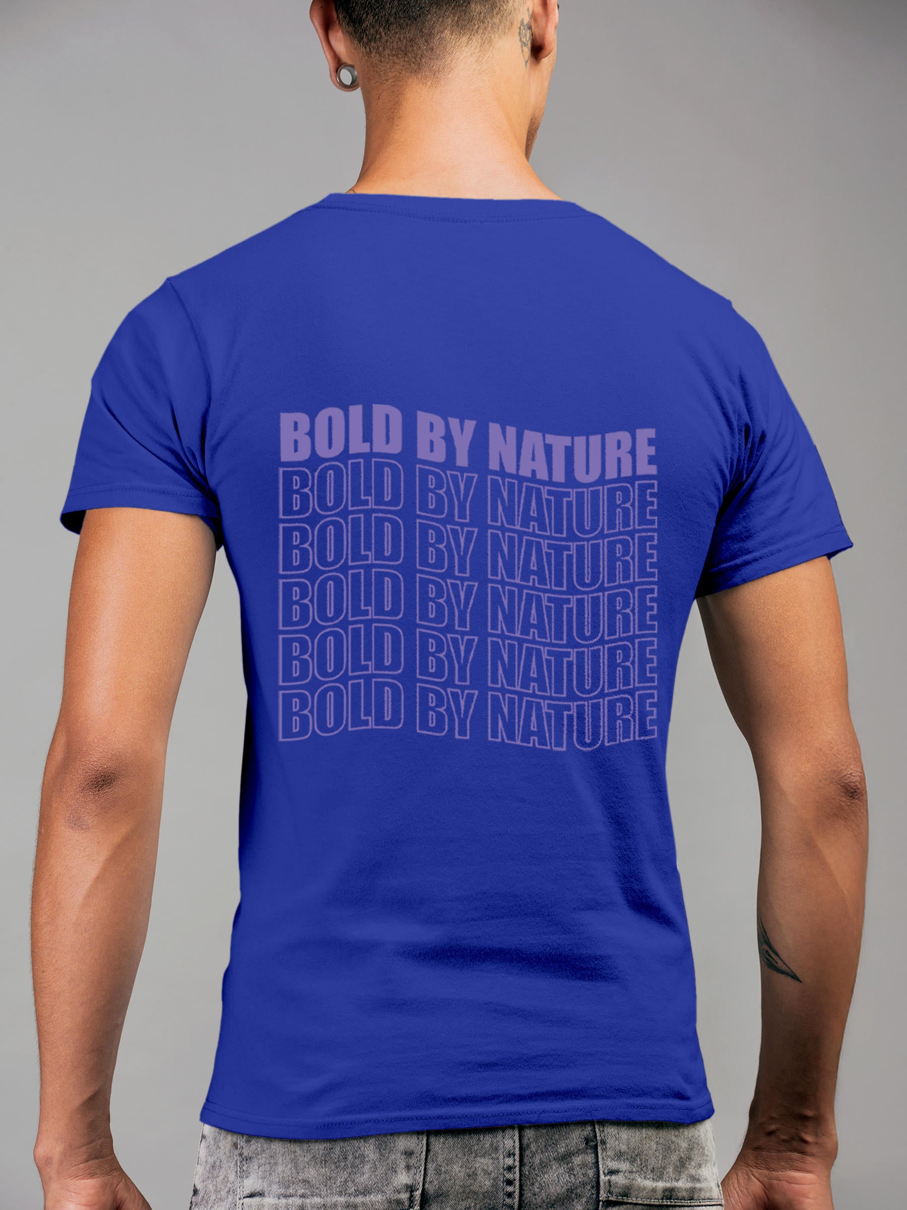 Model wearing Men's Blue Round Neck T-shirt with 'Bold By Nature' design, offering effortless style and premium comfort