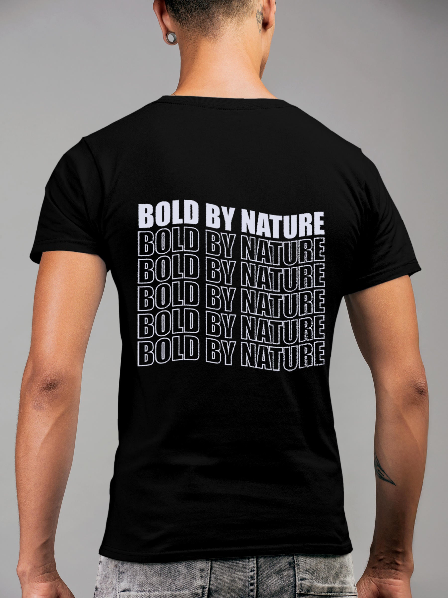 Model wearing Men's Black Round Neck T-shirt with 'Bold By Nature' design, offering effortless style and premium comfort