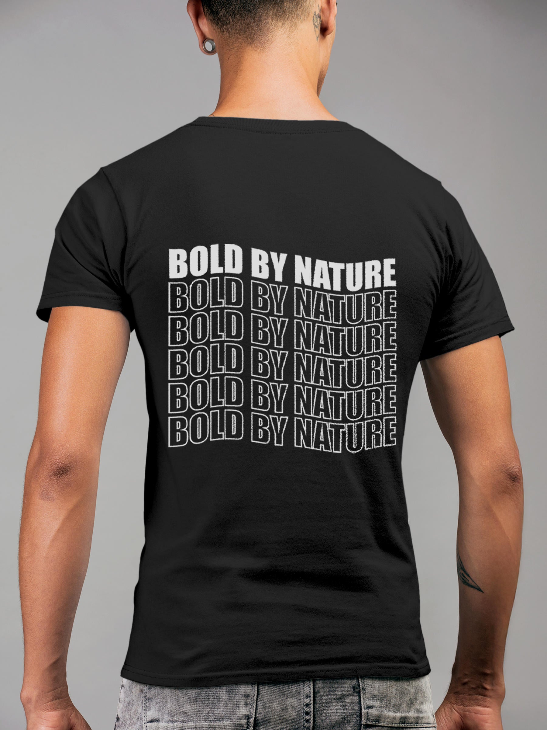 Model wearing Men's Dark Grey Round Neck T-shirt with 'Bold By Nature' design, offering effortless style and premium comfort