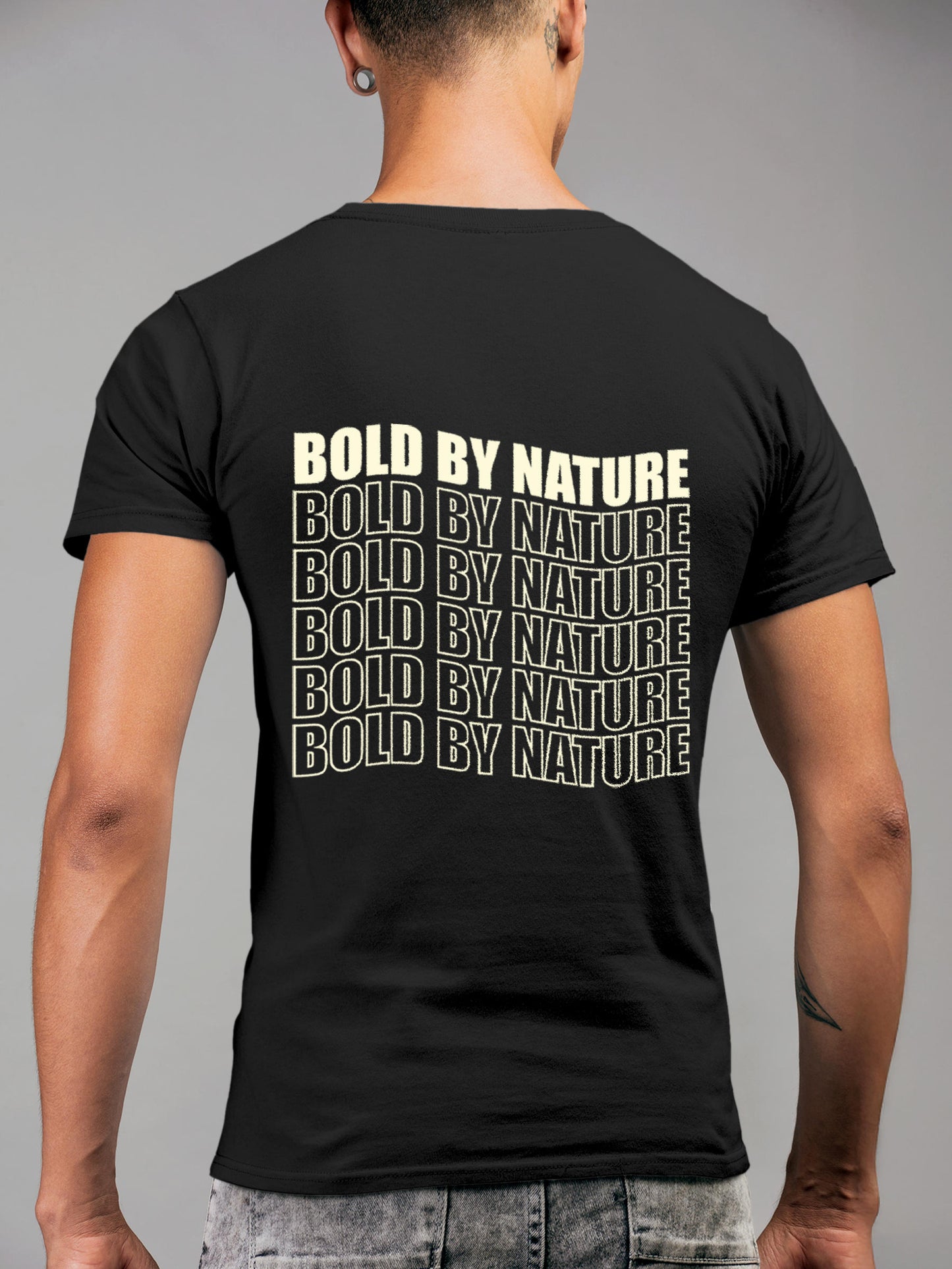 Model wearing Men's Dark Grey Round Neck T-shirt with 'Bold By Nature' design, offering effortless style and premium comfort