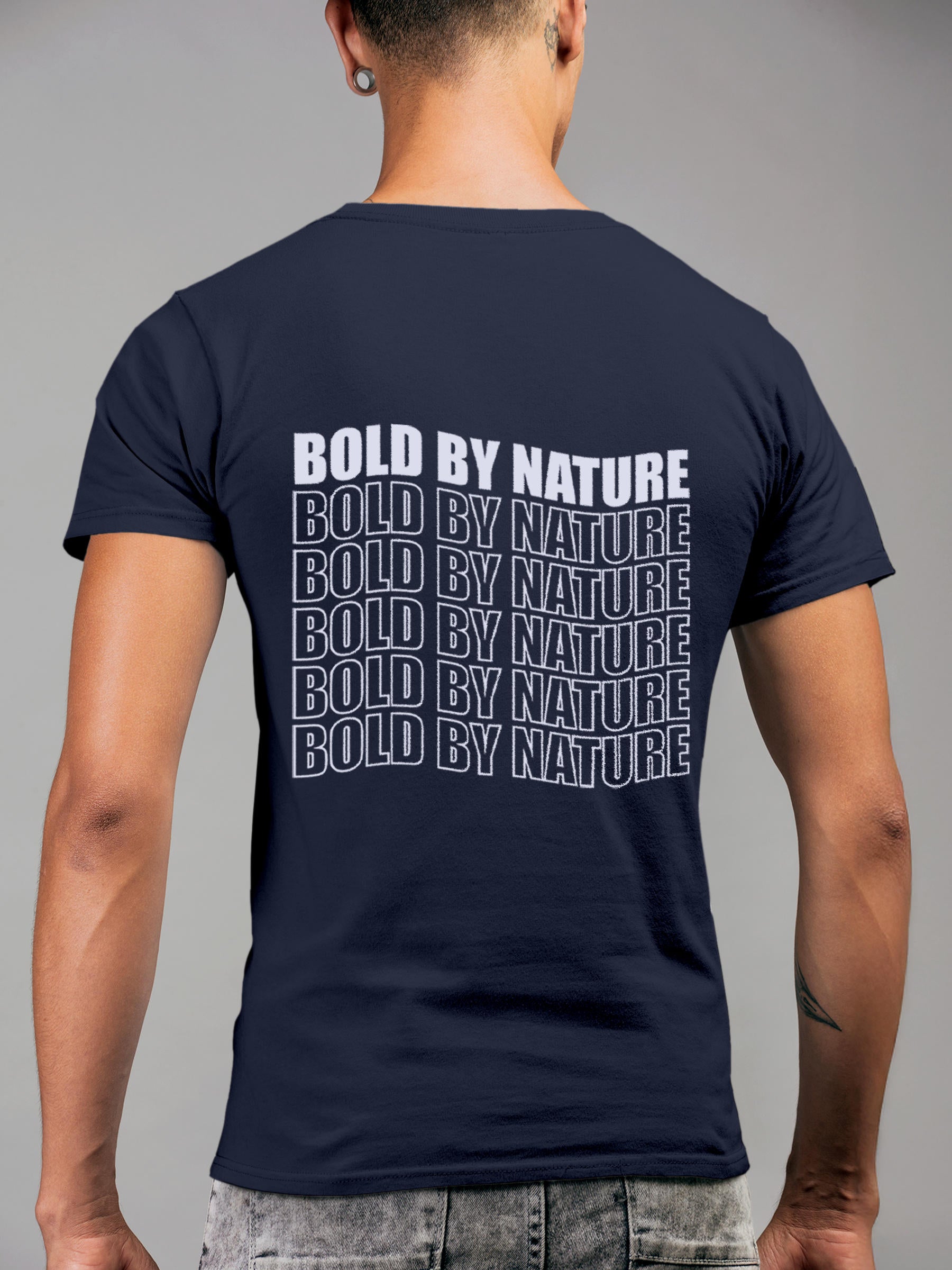 Model wearing Men's Navy Blue Round Neck T-shirt with 'Bold By Nature' design, offering effortless style and premium comfort