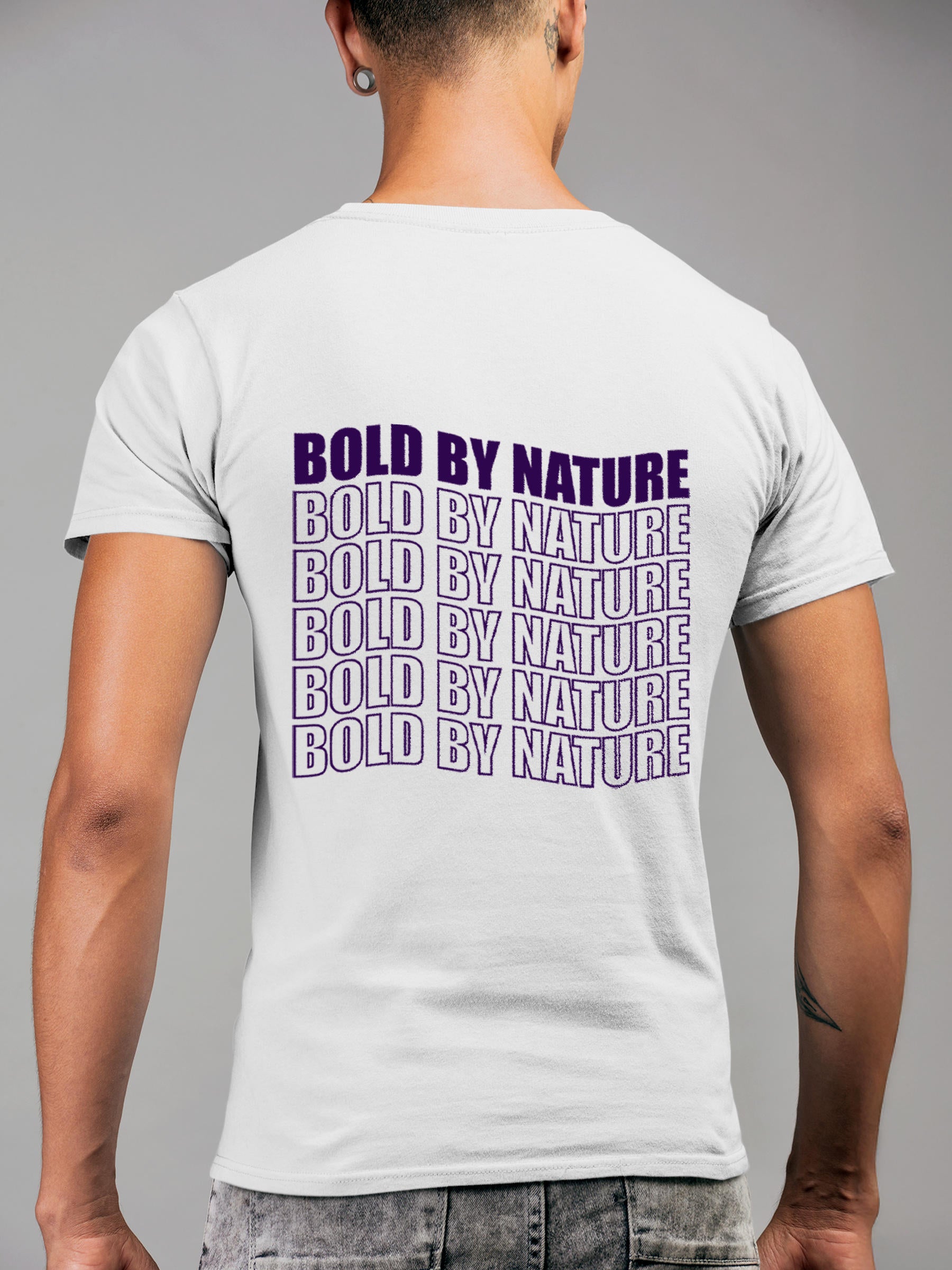 Model wearing Men's White Round Neck T-shirt with 'Bold By Nature' design, offering effortless style and premium comfort