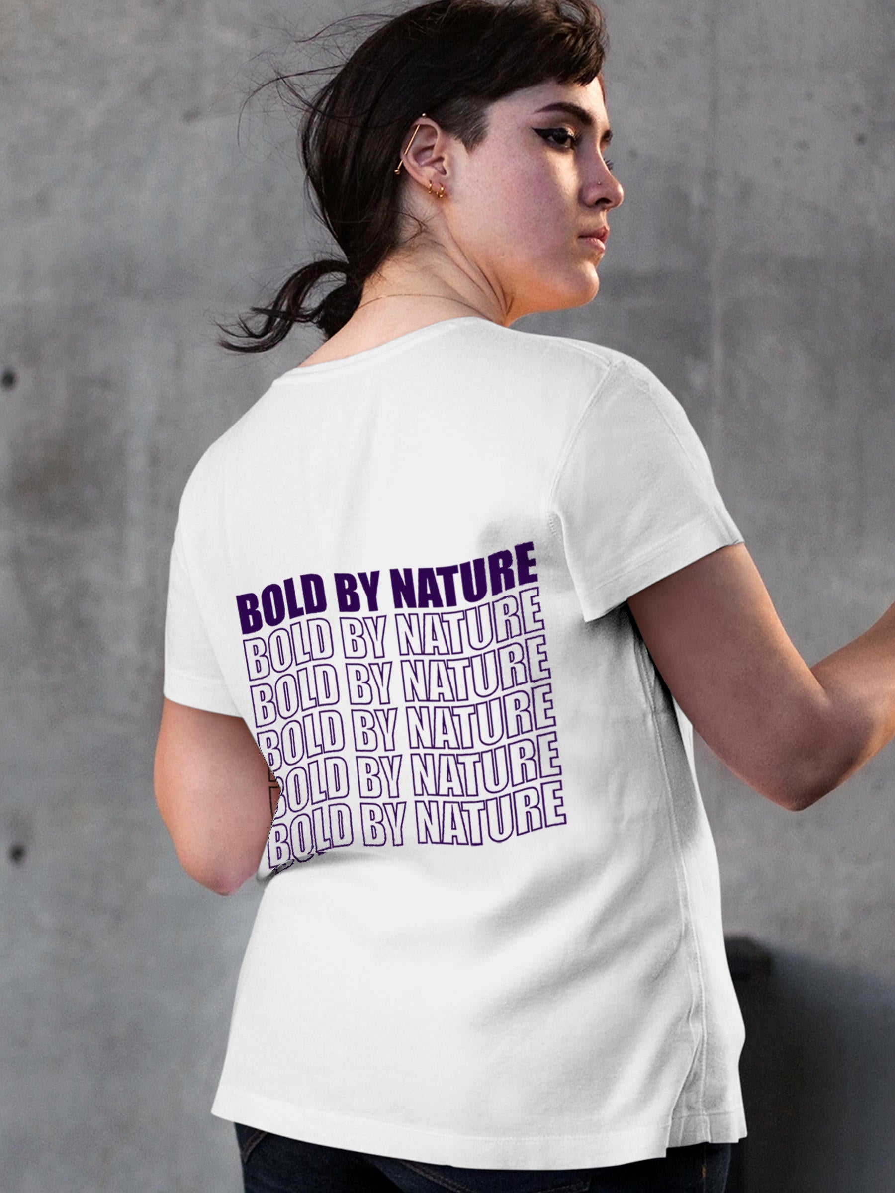 Model wearing Women's White Round Neck T-shirt with 'Bold By Nature' design, offering effortless style and premium comfort