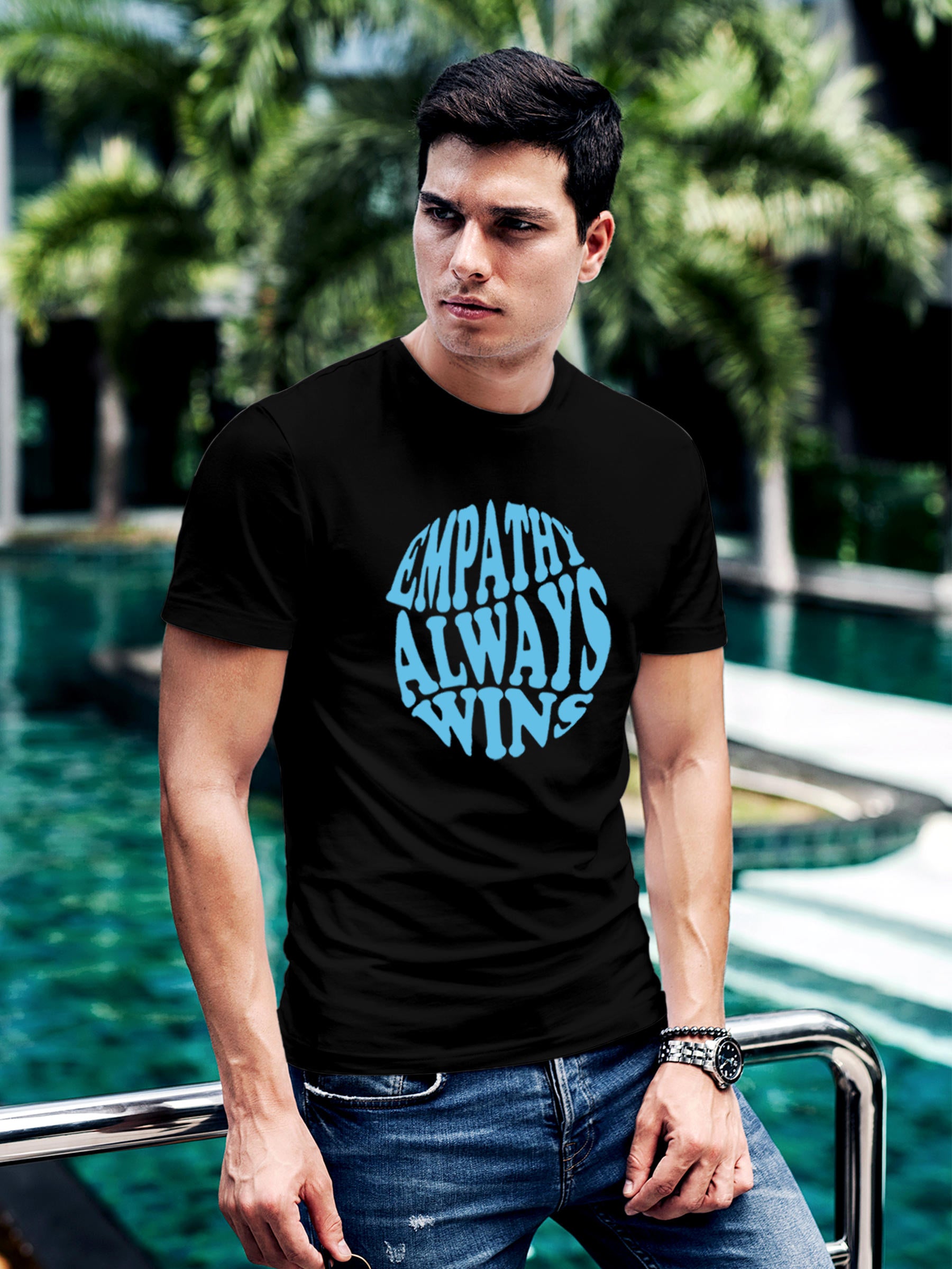 Model wearing Men's Black Round Neck T-shirt with 'Empathy Always Wins' design, offering effortless style and premium comfort