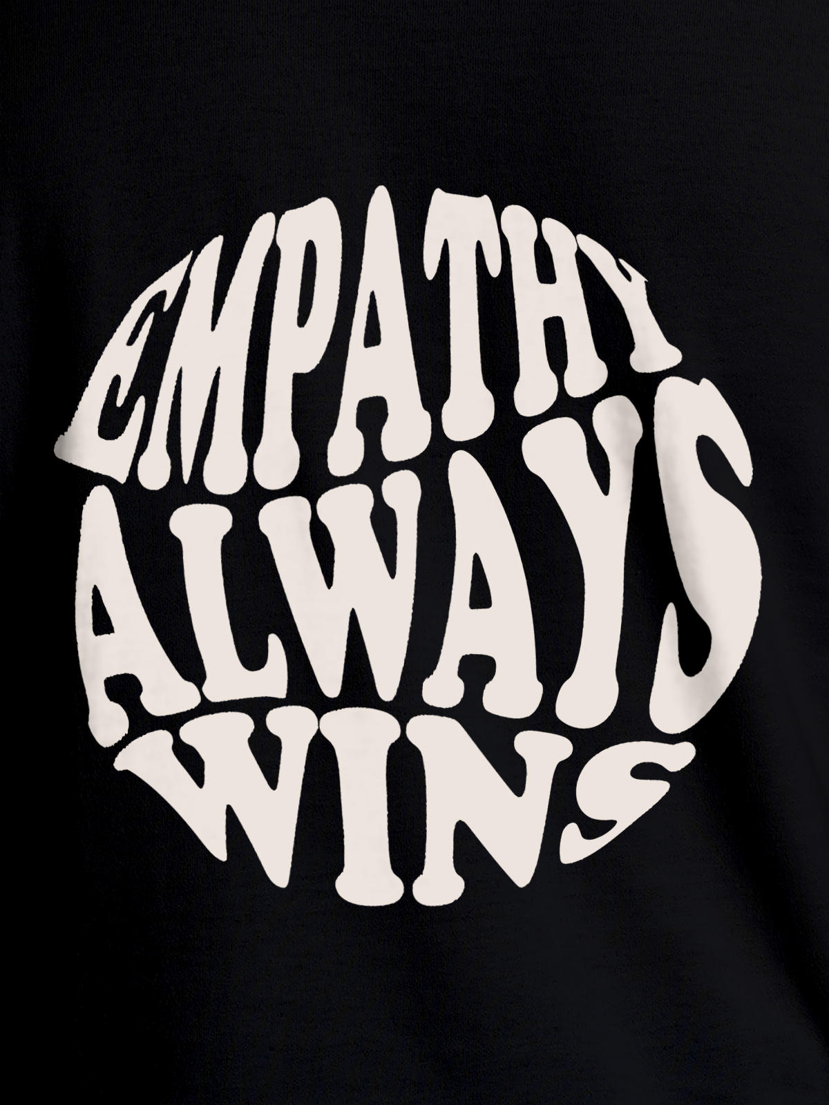 Close up of 'Empathy Always Wins' design on Men's Black Round Neck T-shirt, highlighting intricate details and vibrant print.