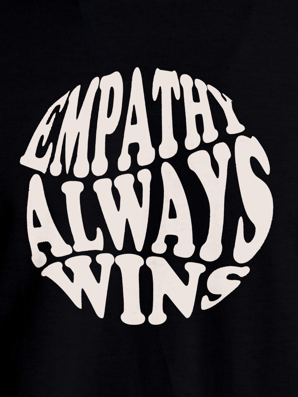 Close up of 'Empathy Always Wins' design on Women's Black Round Neck T-shirt, highlighting intricate details and vibrant print.