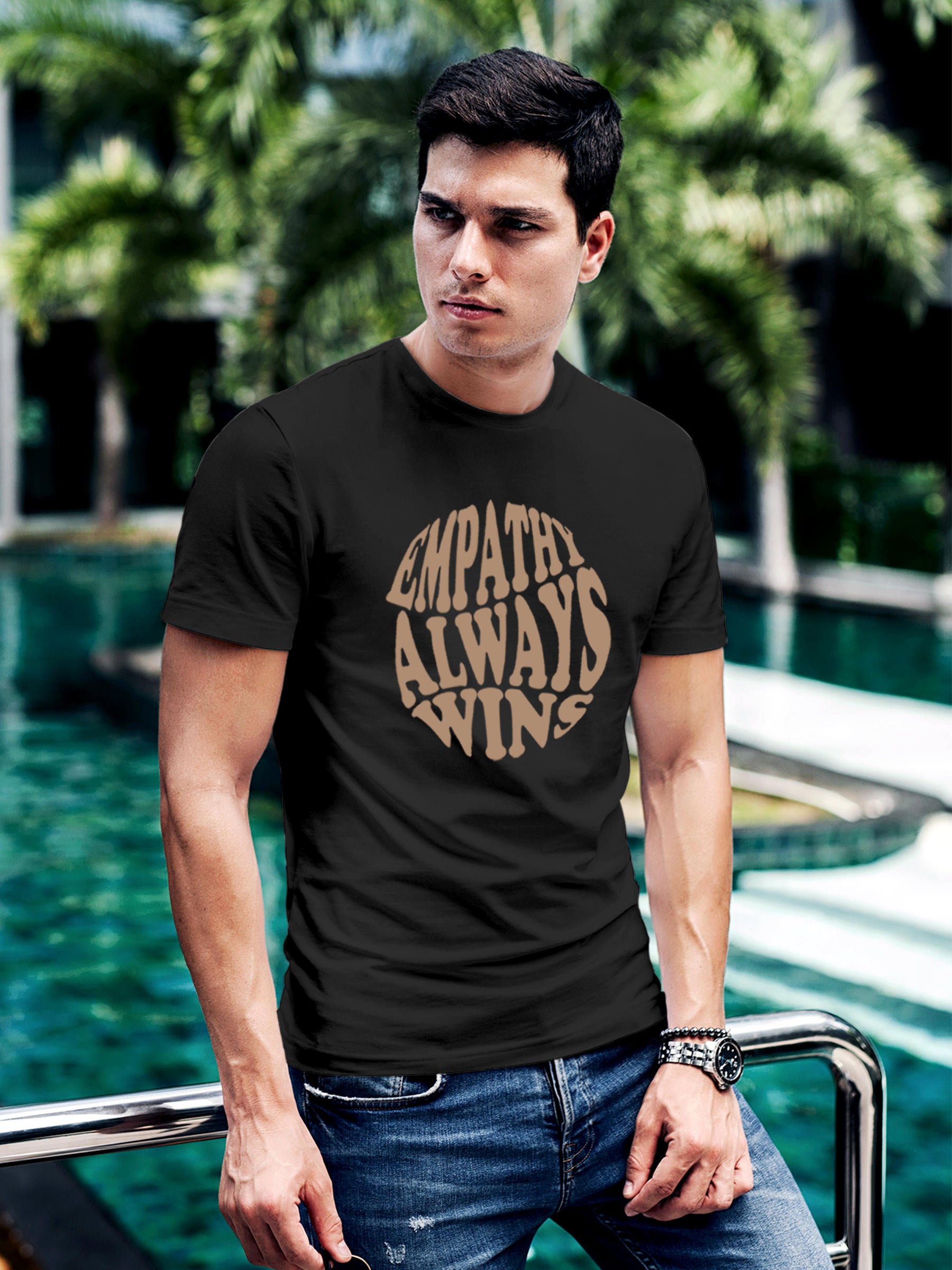 Model wearing Men's Dark Grey Round Neck T-shirt with 'Empathy Always Wins' design, offering effortless style and premium comfort