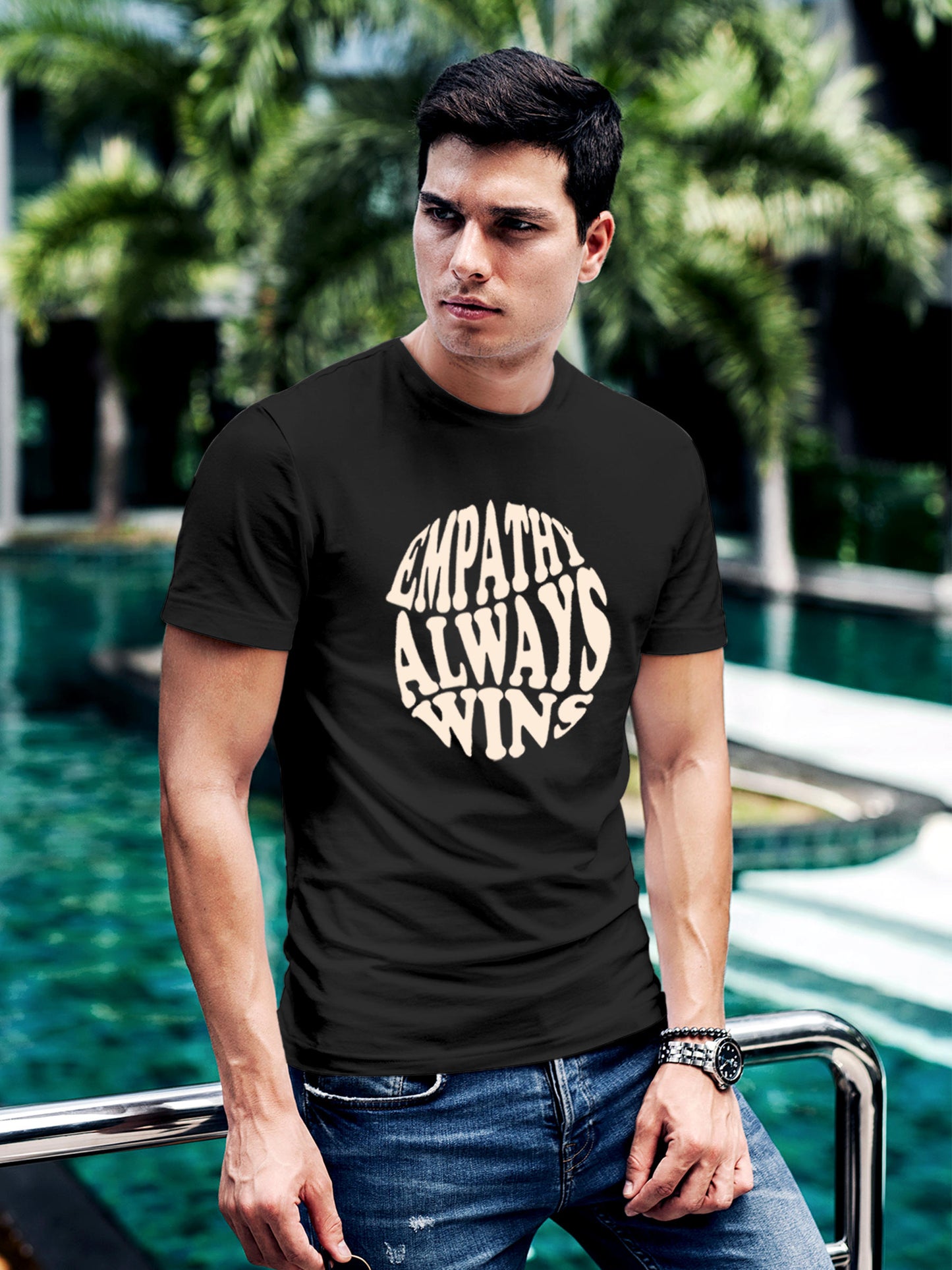 Model wearing Men's Dark Grey Round Neck T-shirt with 'Empathy Always Wins' design, offering effortless style and premium comfort