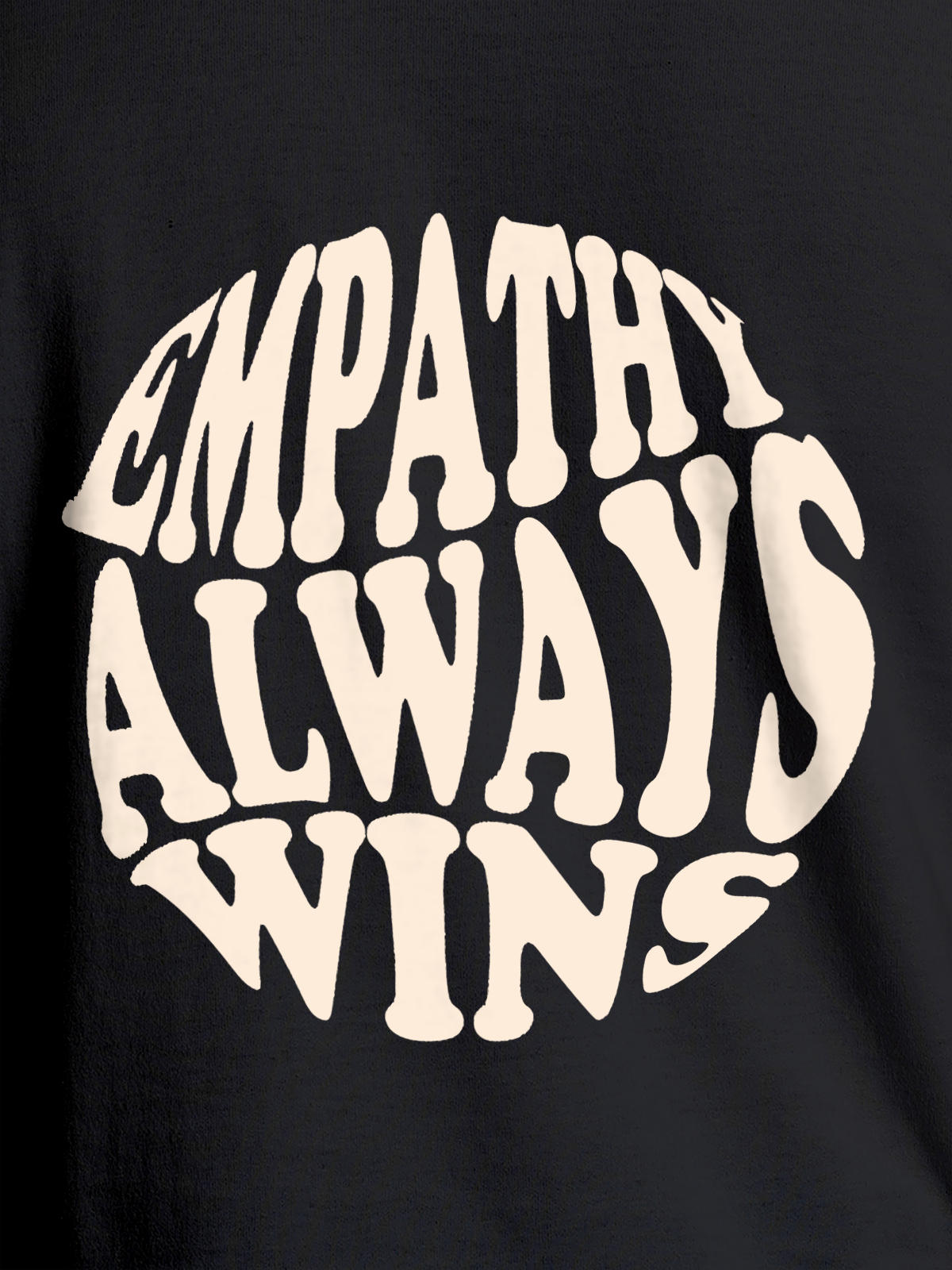 Close up of 'Empathy Always Wins' design on Men's Dark Grey Round Neck T-shirt, highlighting intricate details and vibrant print.