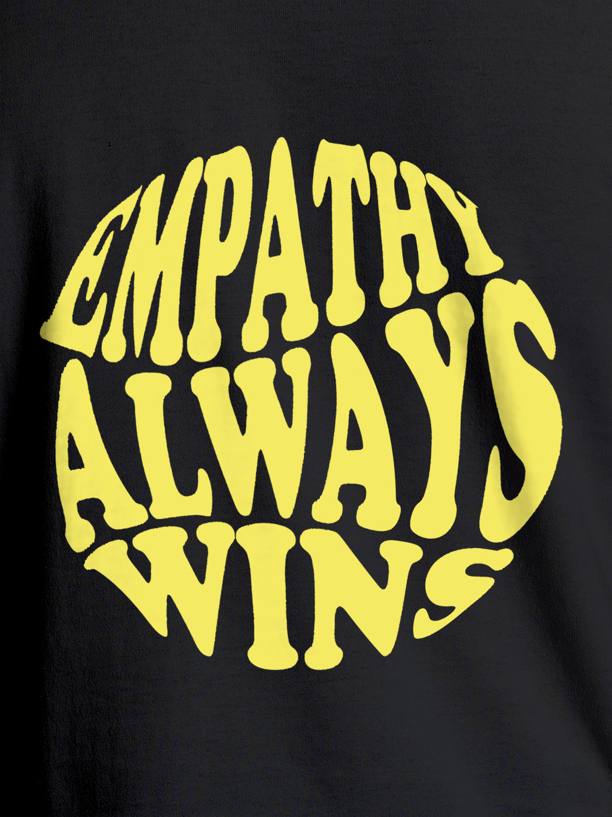 Close up of 'Empathy Always Wins' design on Men's Dark Grey Round Neck T-shirt, highlighting intricate details and vibrant print.