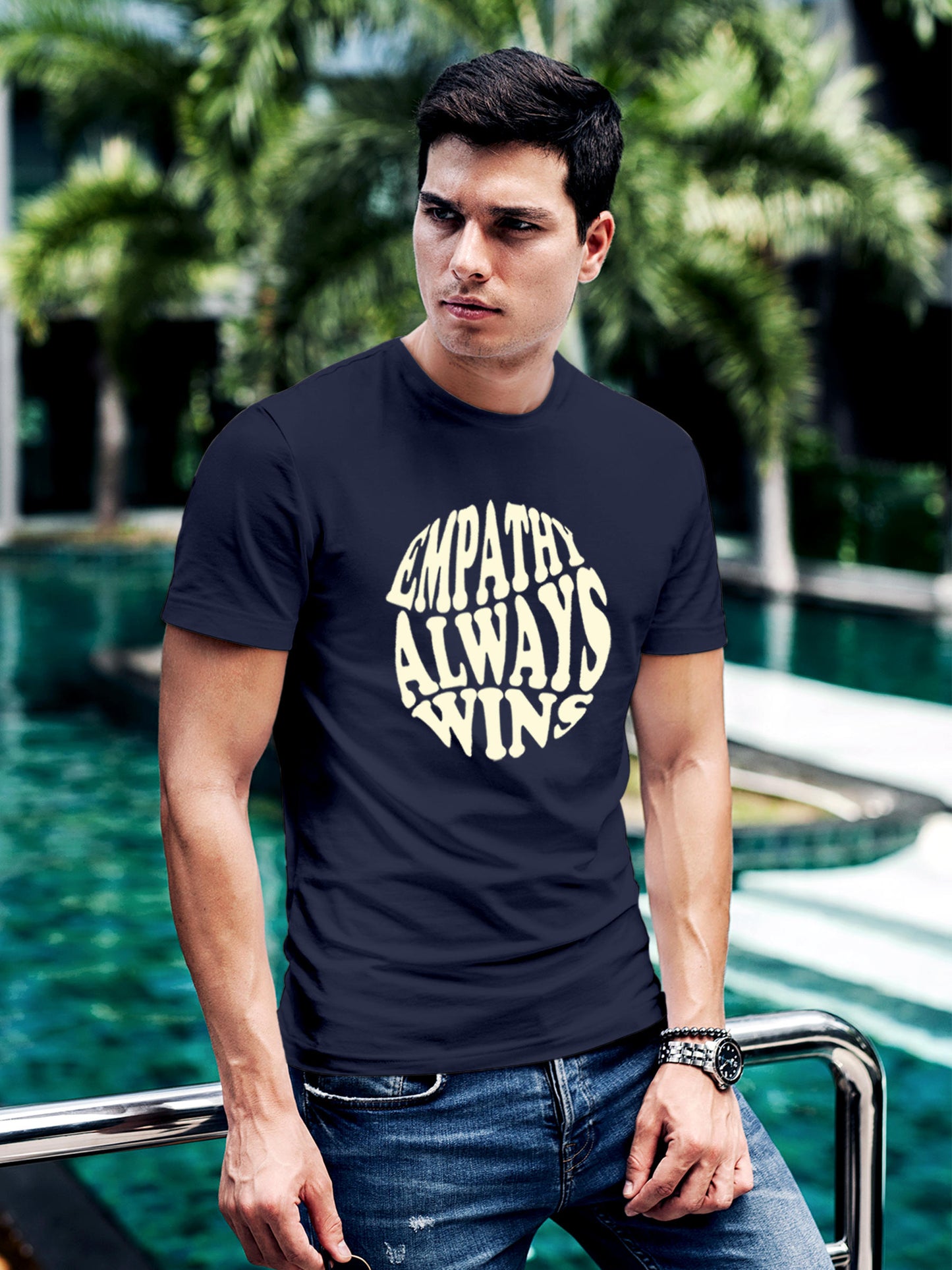 Model wearing Men's Navy Blue Round Neck T-shirt with 'Empathy Always Wins' design, offering effortless style and premium comfort