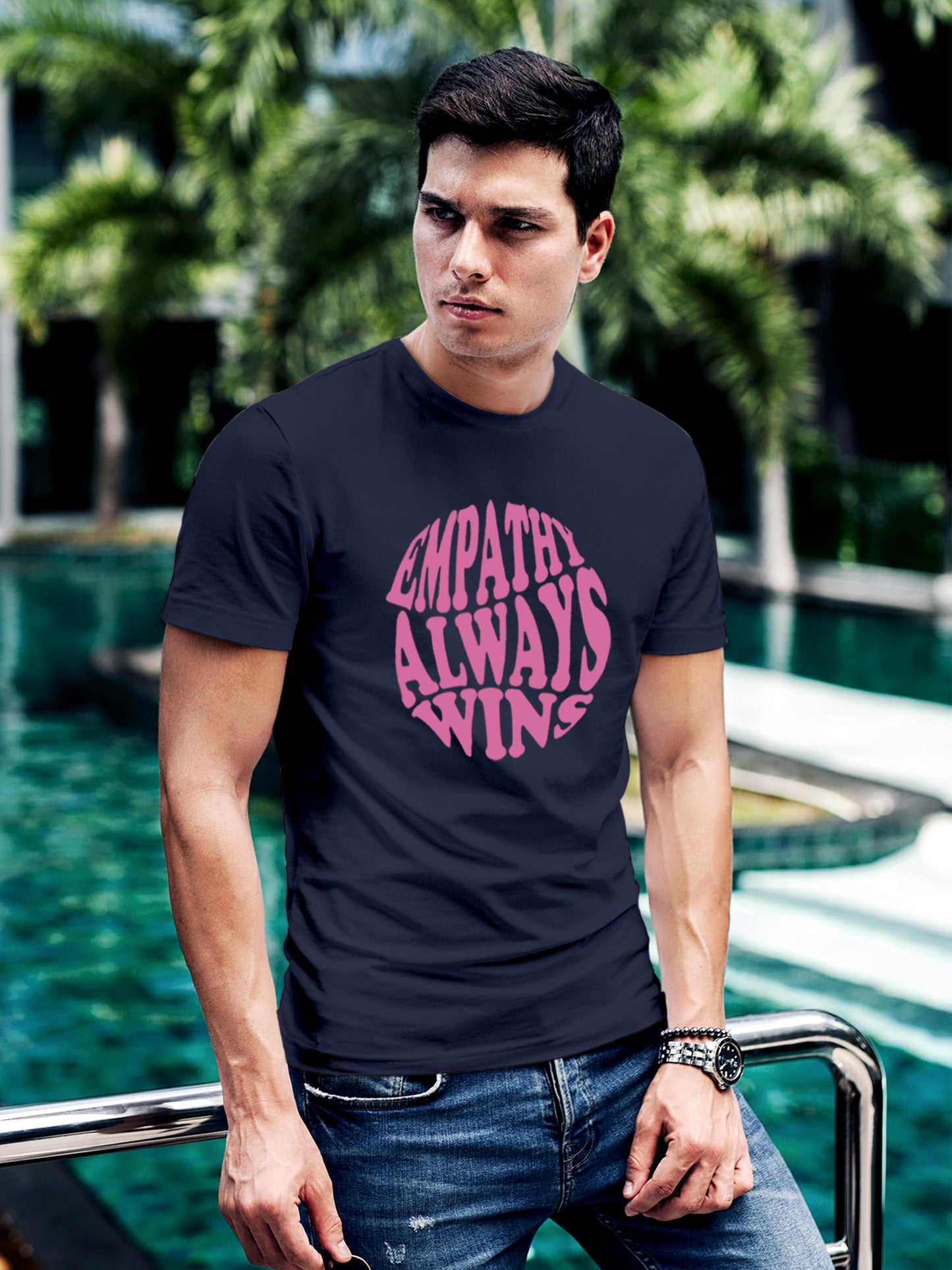 Model wearing Men's Navy Blue Round Neck T-shirt with 'Empathy Always Wins' design, offering effortless style and premium comfort