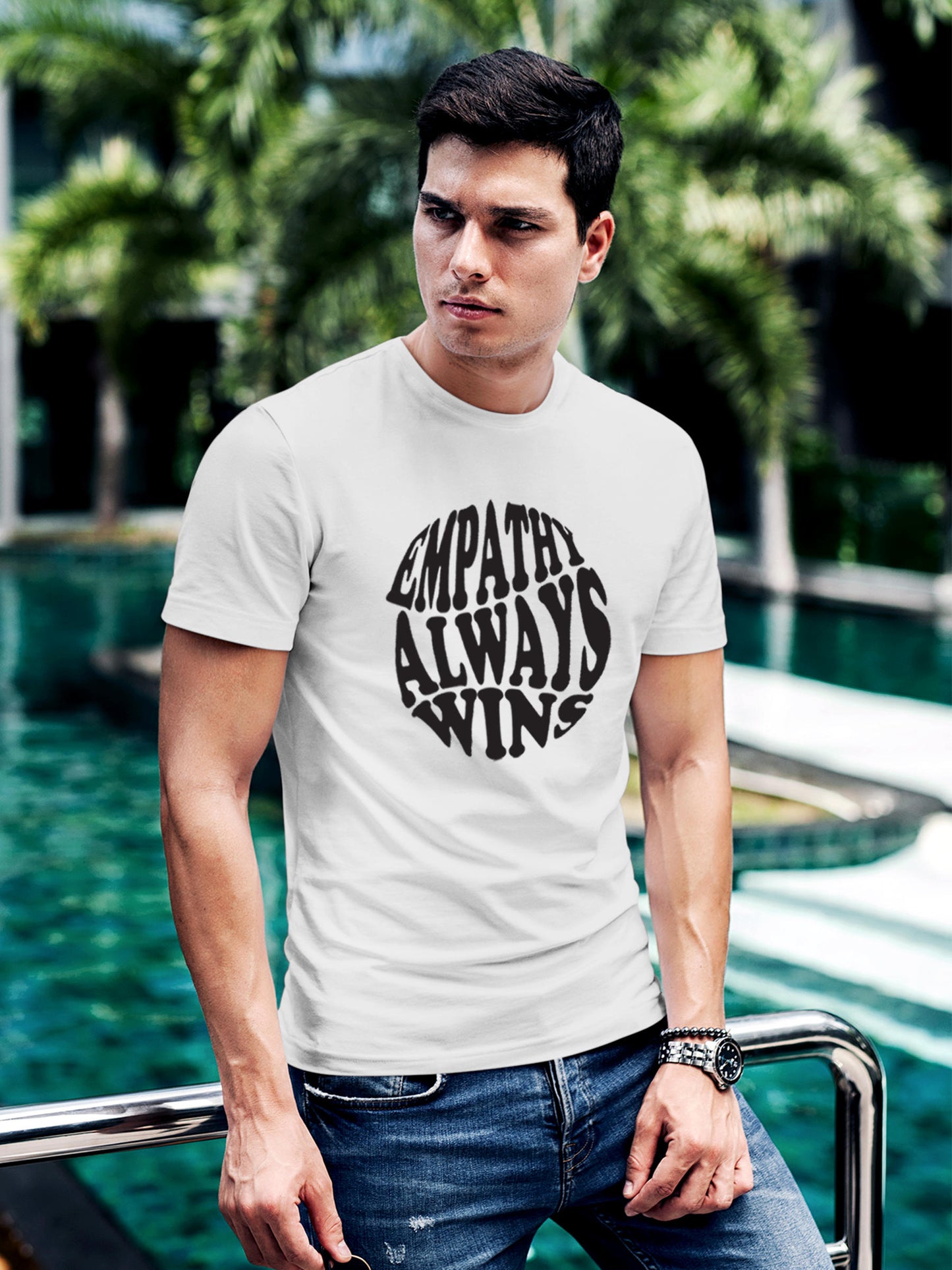Model wearing Men's White Round Neck T-shirt with 'Empathy Always Wins' design, offering effortless style and premium comfort