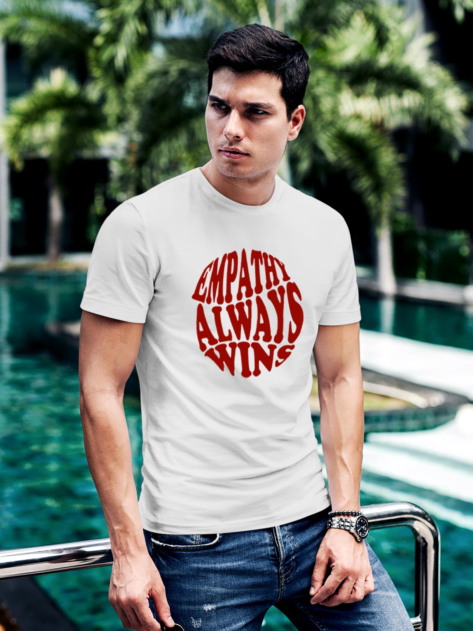 Model wearing Men's White Round Neck T-shirt with 'Empathy Always Wins' design, offering effortless style and premium comfort