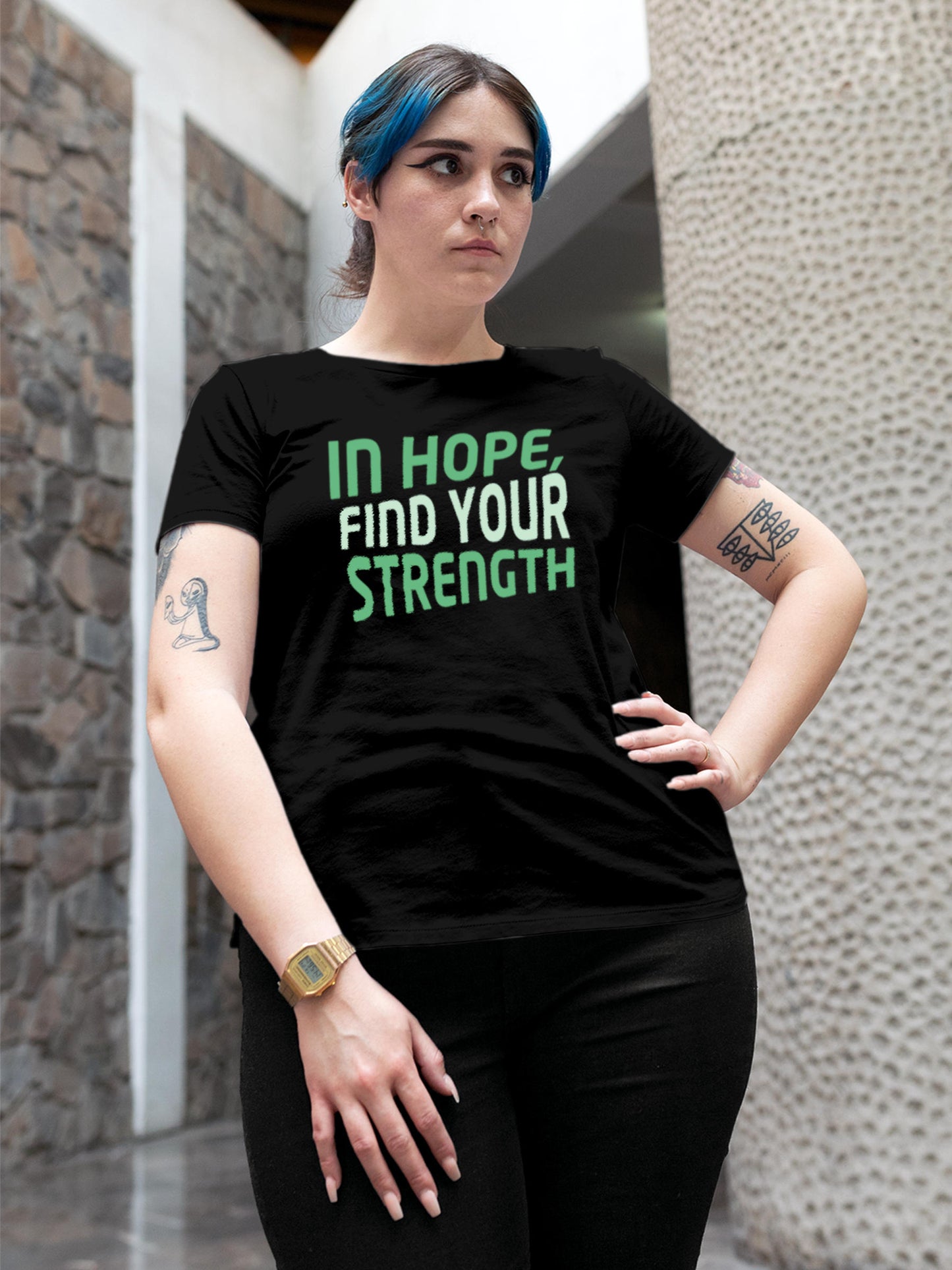 Model wearing Women's Black Round Neck T-shirt with 'In Hope, Find Your Strength' design, offering effortless style and premium comfort