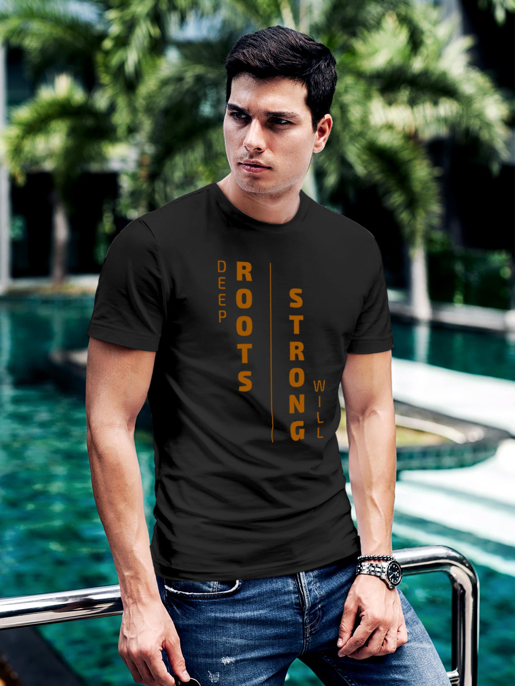 Model wearing Men's Dark Grey Round Neck T-shirt with 'Deep Roots Strong Will' design, offering effortless style and premium comfort