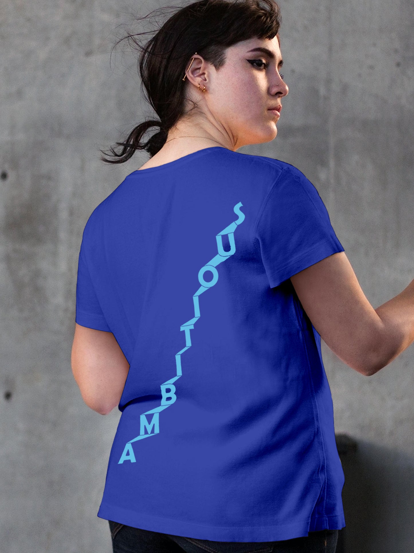 Model wearing Women's Blue Round Neck T-shirt with 'Ambitious' design, offering effortless style and premium comfort