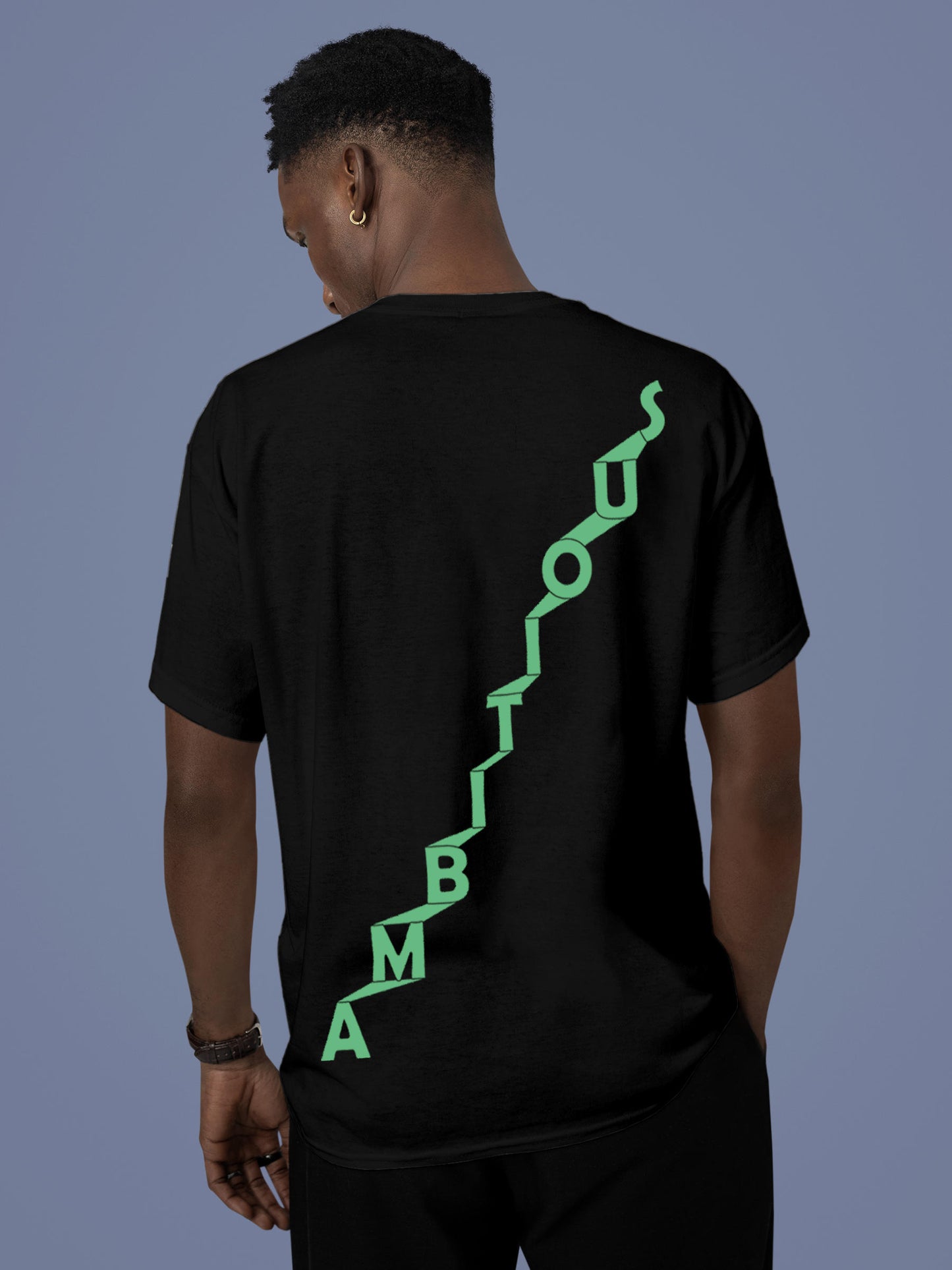 Model wearing Men's Black Round Neck T-shirt with 'Ambitious' design, offering effortless style and premium comfort