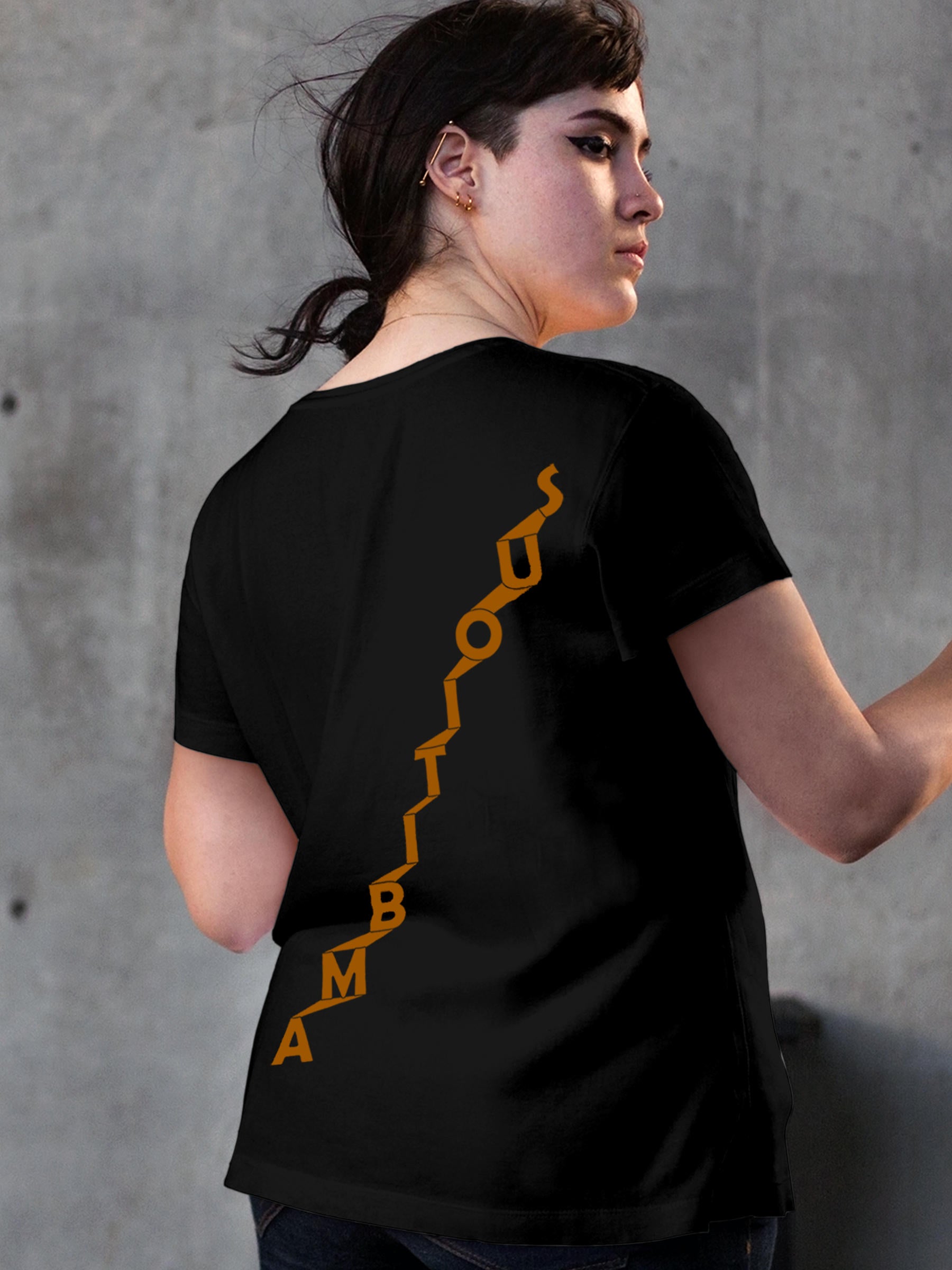 Model wearing Women's Black Round Neck T-shirt with 'Ambitious' design, offering effortless style and premium comfort
