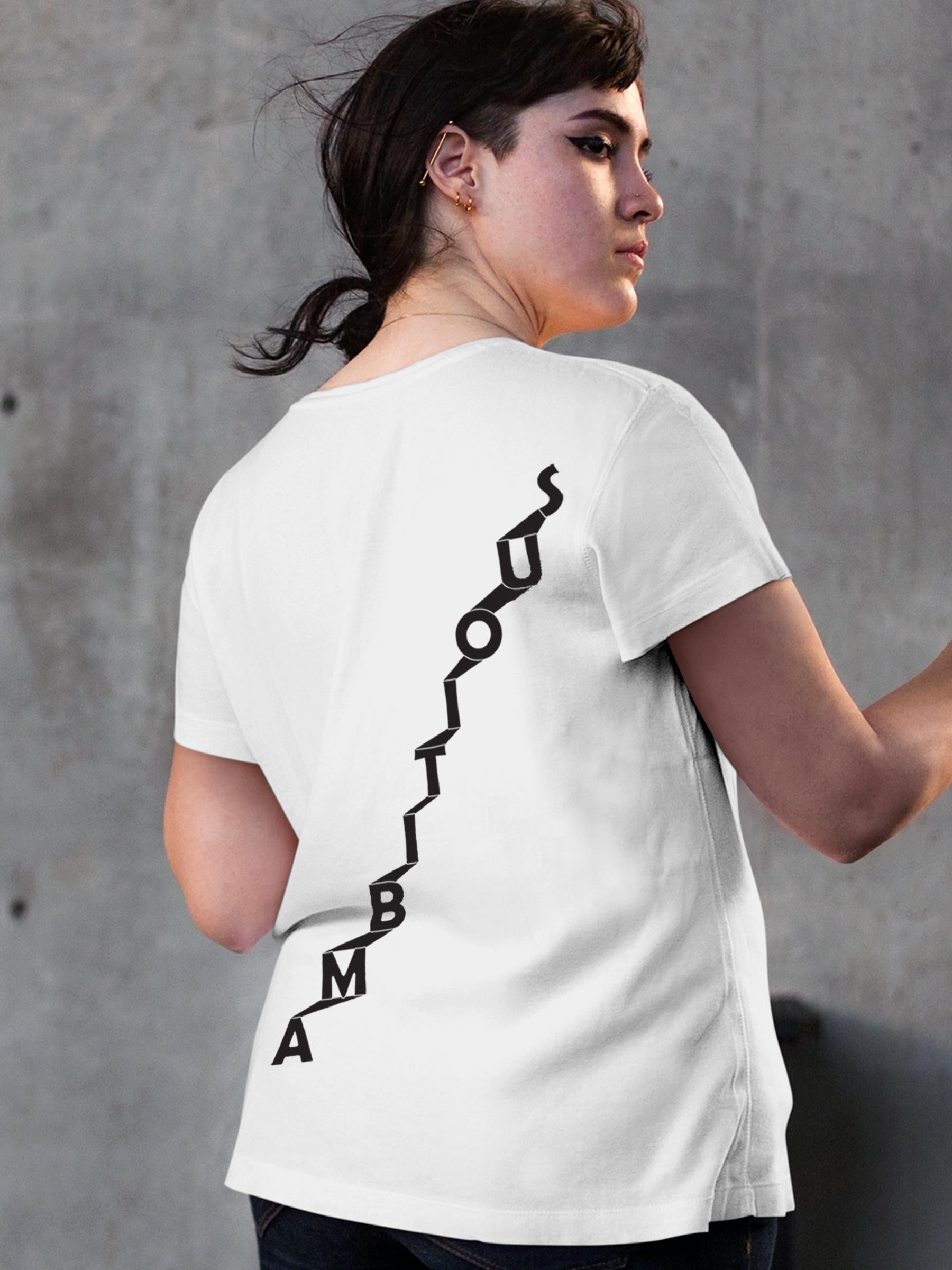 Model wearing Women's White Round Neck T-shirt with 'Ambitious' design, offering effortless style and premium comfort