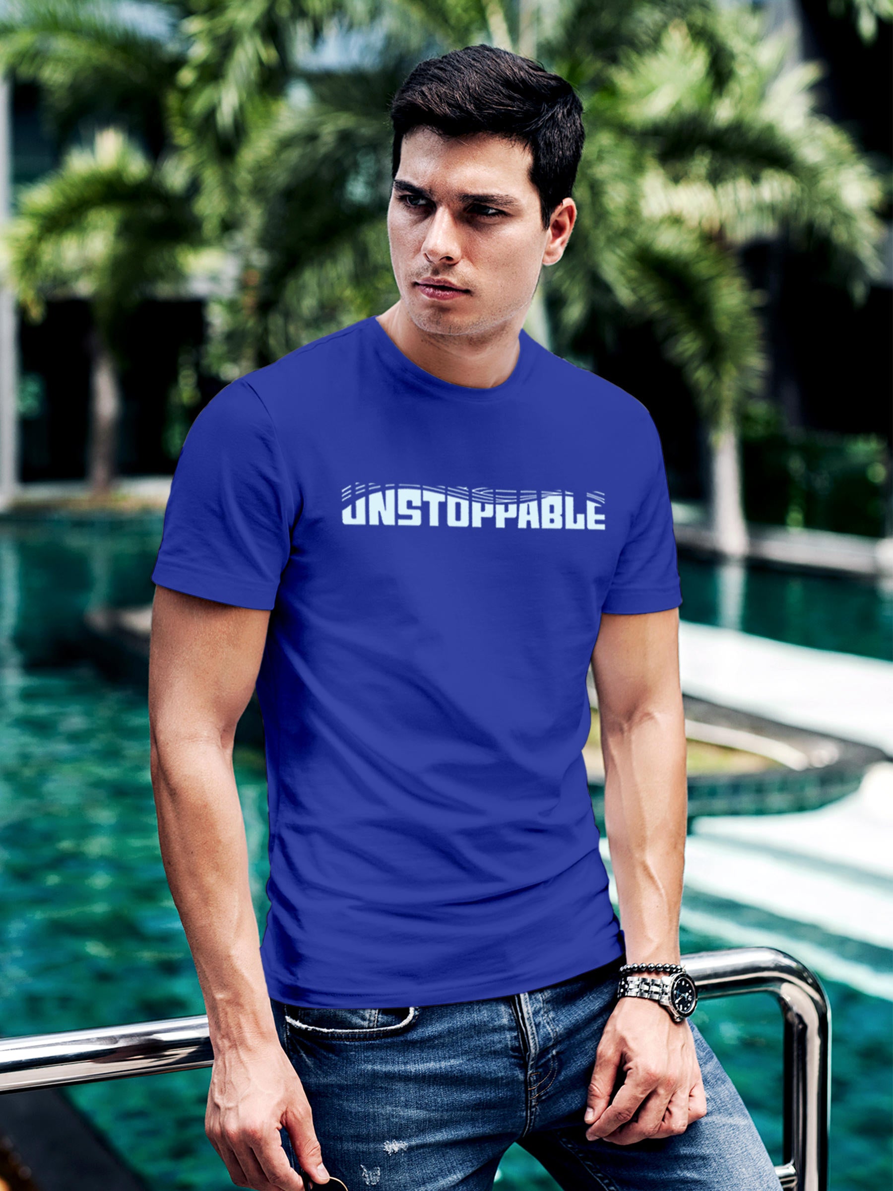 Model wearing Men's Blue Round Neck T-shirt with 'Unstoppable' design, offering effortless style and premium comfort