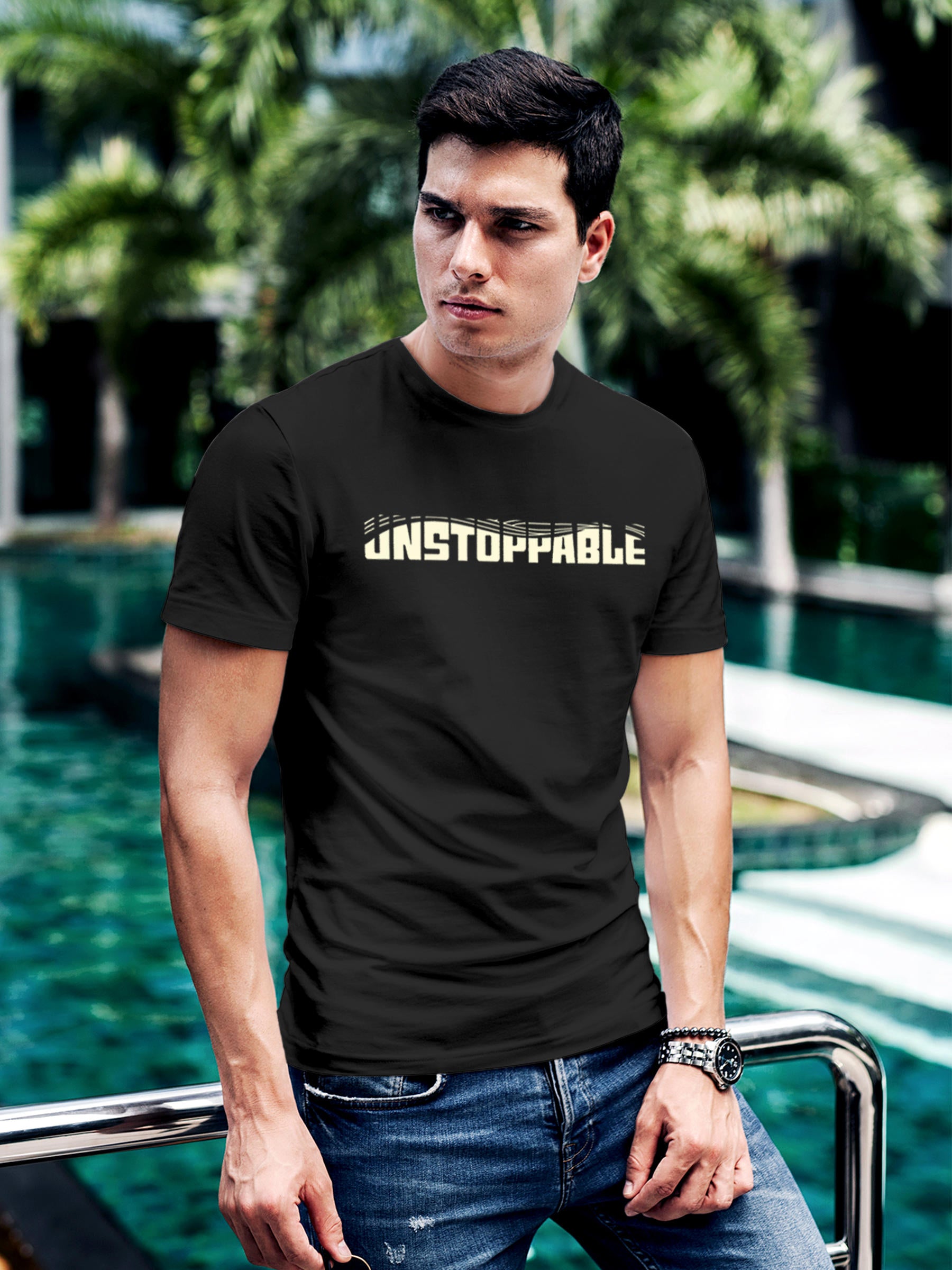 Model wearing Men's Dark Grey Round Neck T-shirt with 'Unstoppable' design, offering effortless style and premium comfort