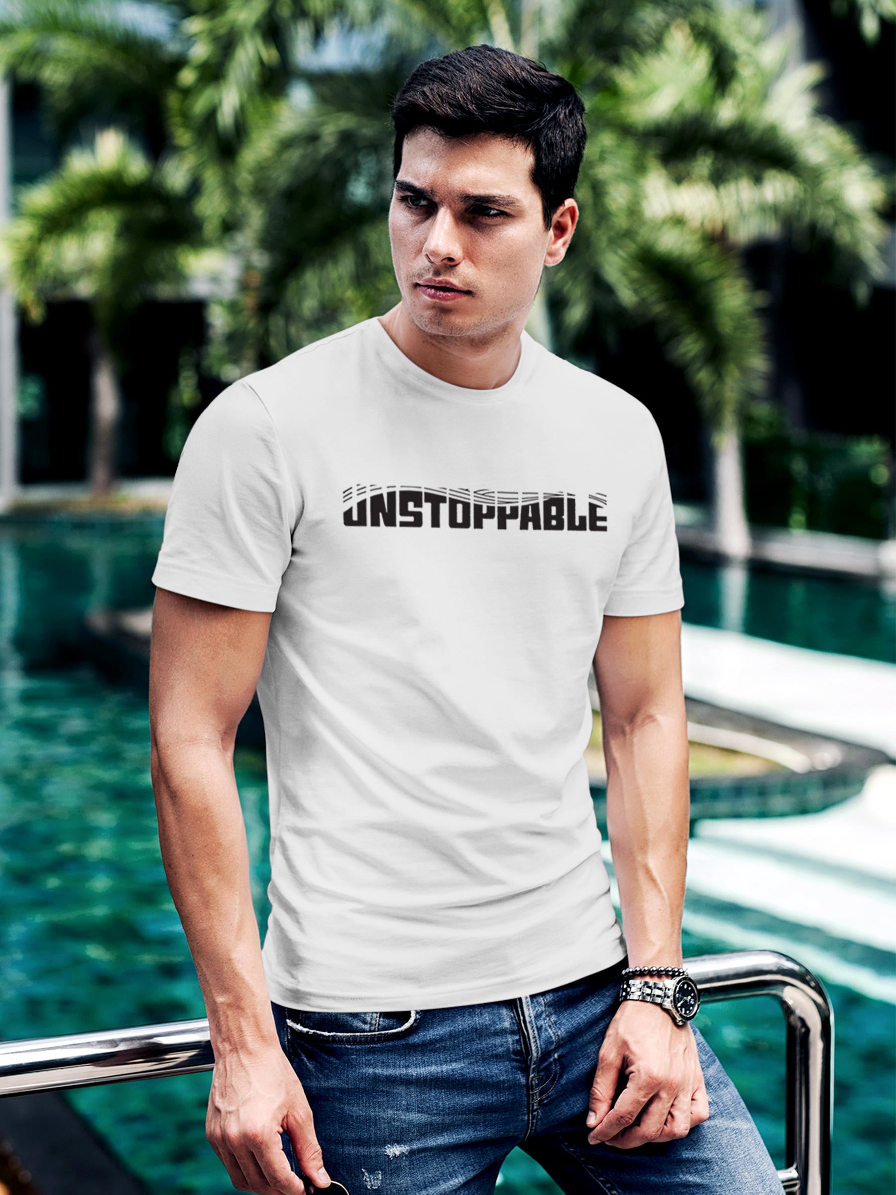 Model wearing Men's White Round Neck T-shirt with 'Unstoppable' design, offering effortless style and premium comfort