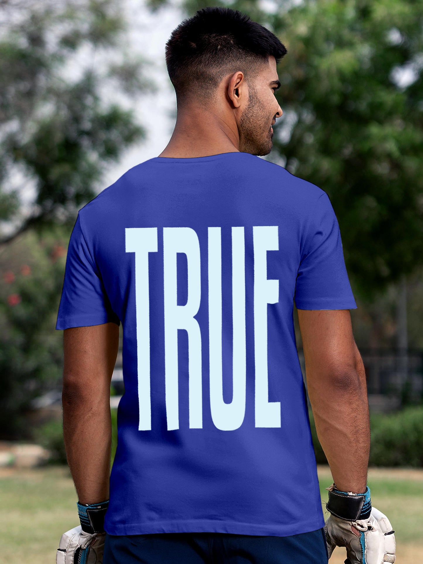Model wearing Men's Blue Round Neck T-shirt with 'Truth' design, offering effortless style and premium comfort