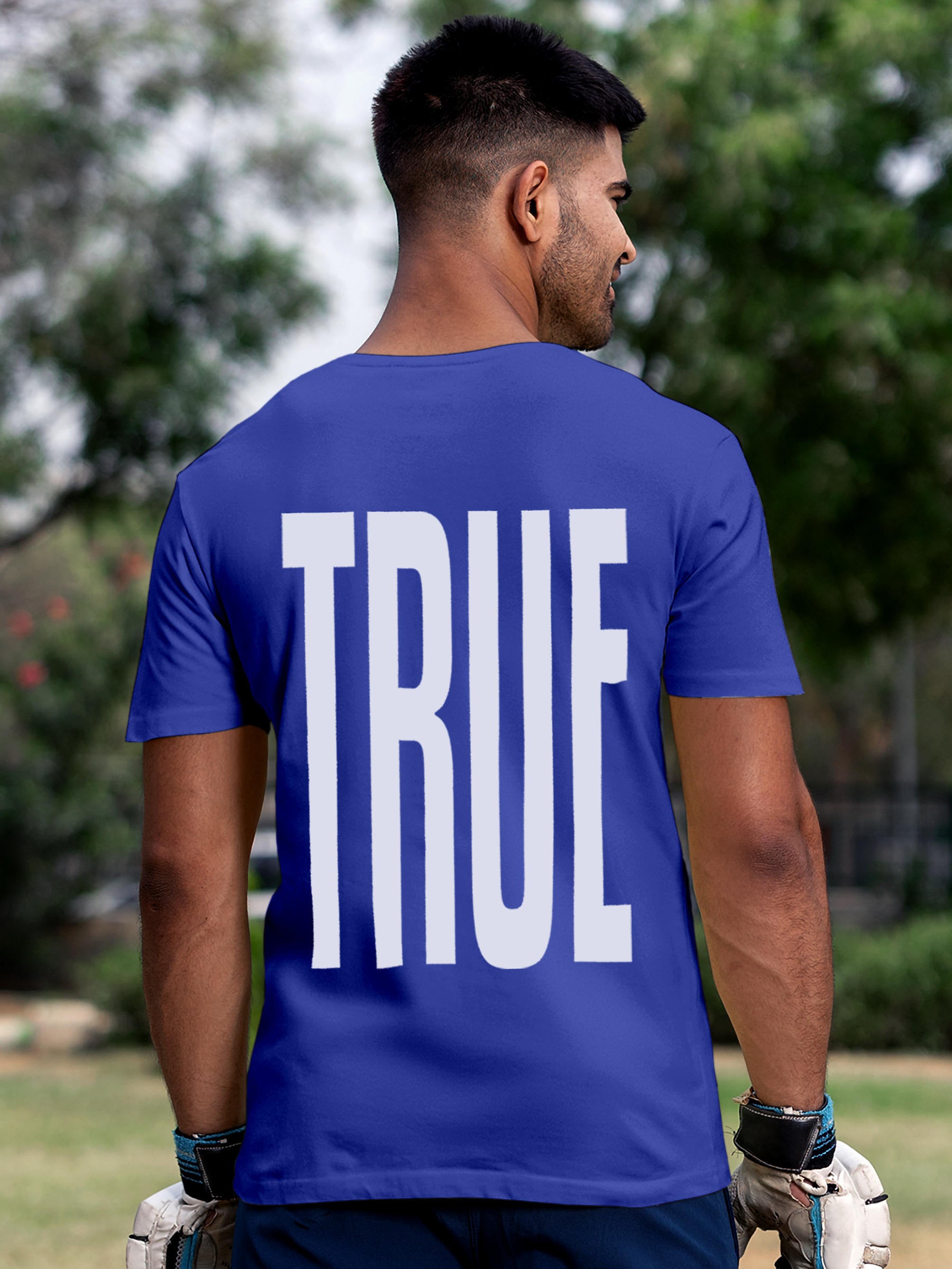 Model wearing Men's Blue Round Neck T-shirt with 'Truth' design, offering effortless style and premium comfort