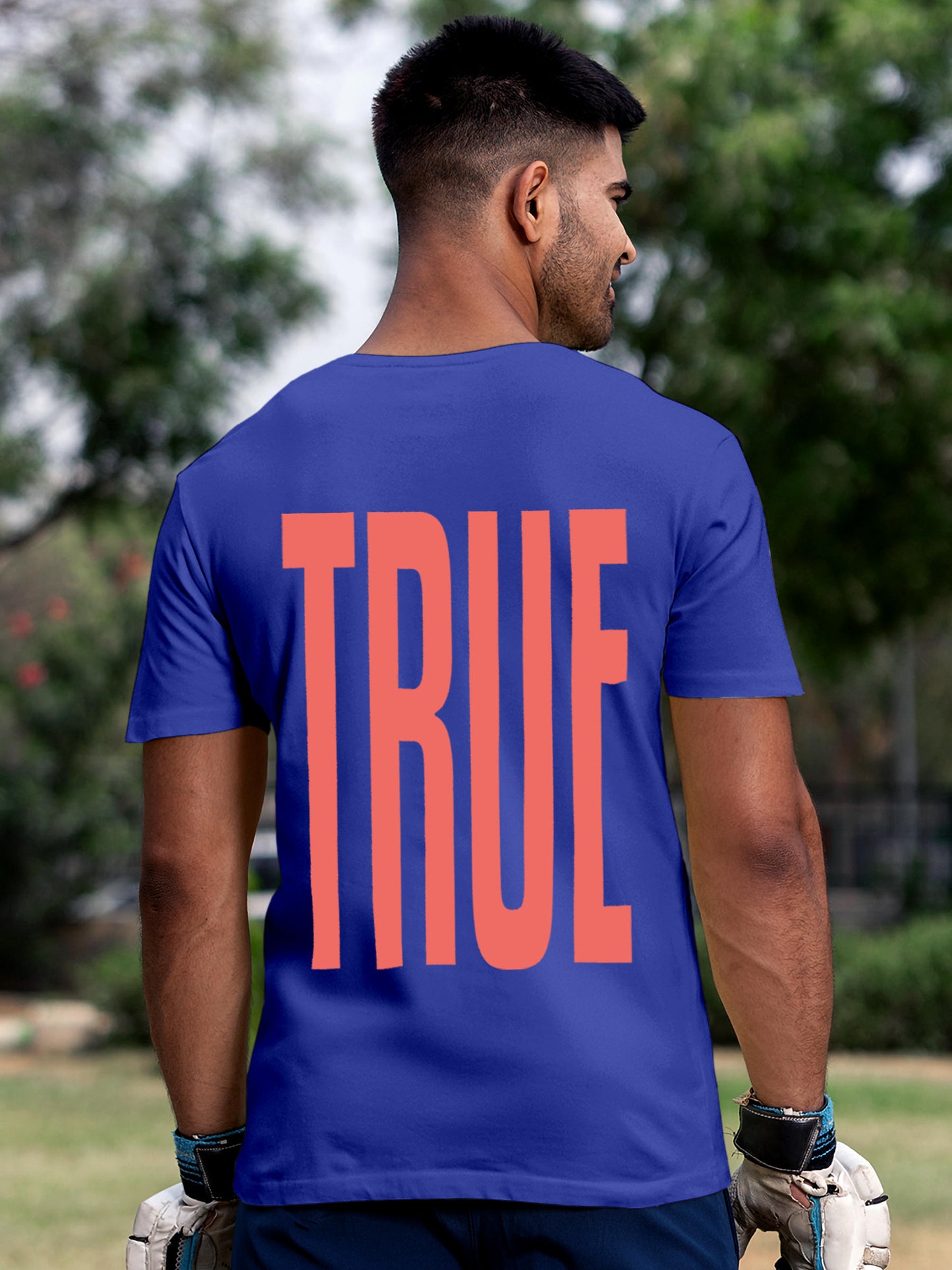Model wearing Men's Blue Round Neck T-shirt with 'Truth' design, offering effortless style and premium comfort