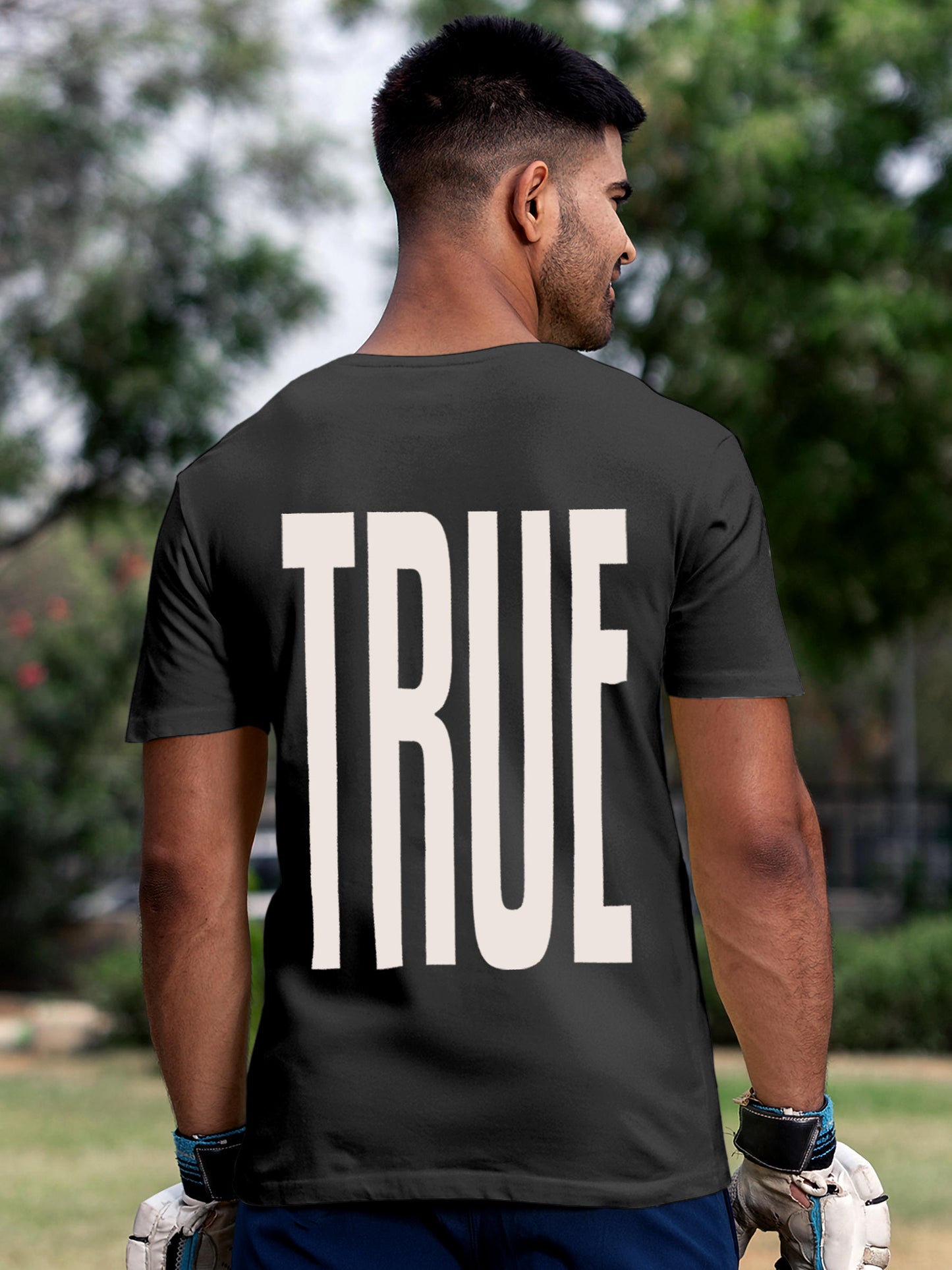 Model wearing Men's Dark Grey Round Neck T-shirt with 'Truth' design, offering effortless style and premium comfort