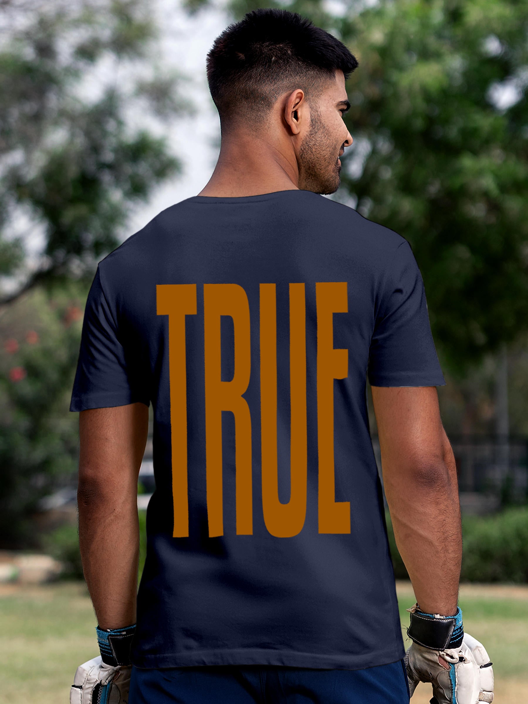 Model wearing Men's Navy Blue Round Neck T-shirt with 'Truth' design, offering effortless style and premium comfort