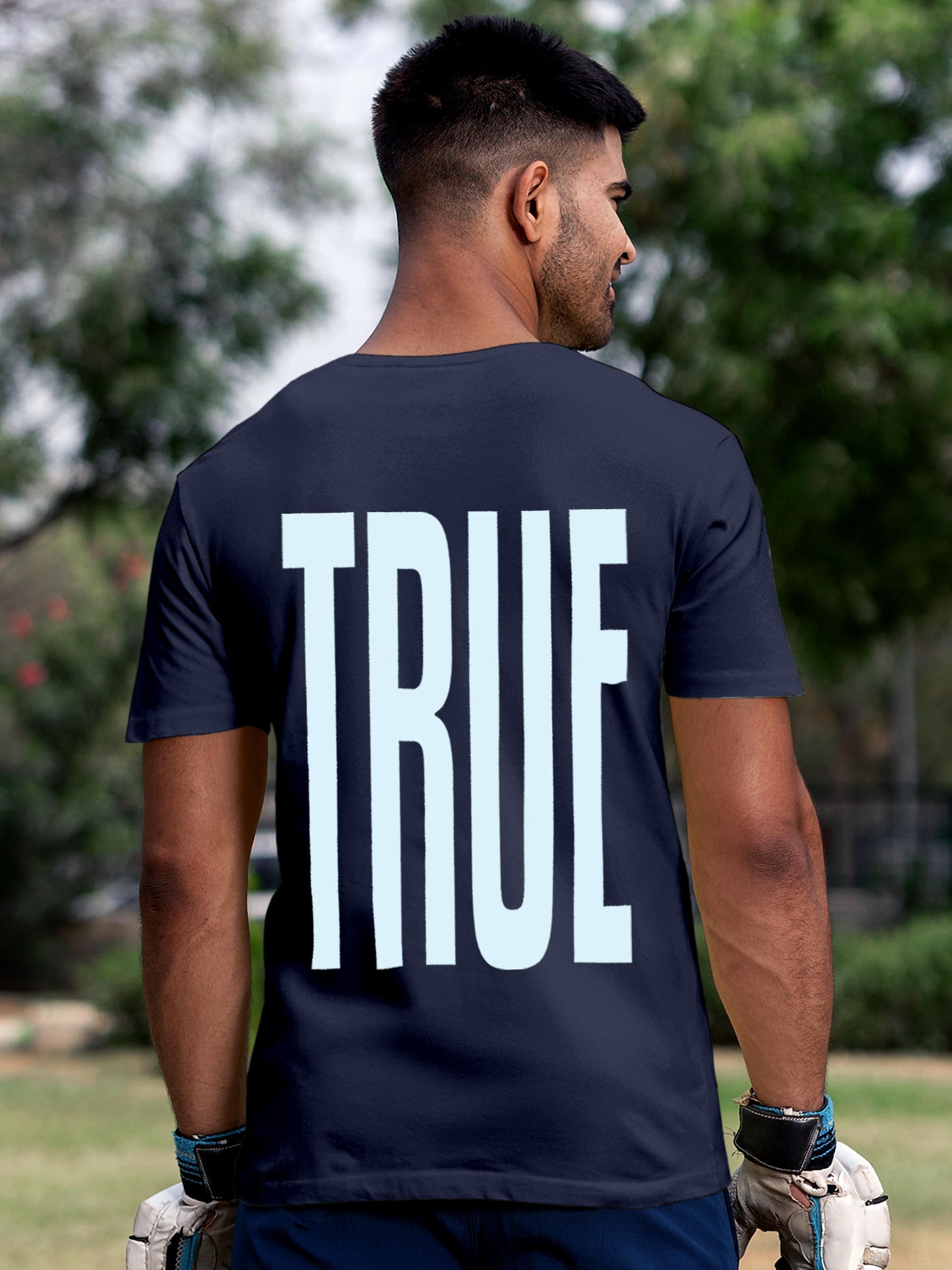 Model wearing Men's Navy Blue Round Neck T-shirt with 'Truth' design, offering effortless style and premium comfort