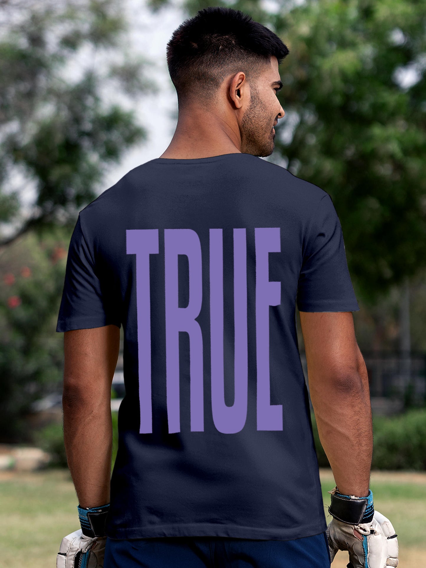 Model wearing Men's Navy Blue Round Neck T-shirt with 'Truth' design, offering effortless style and premium comfort
