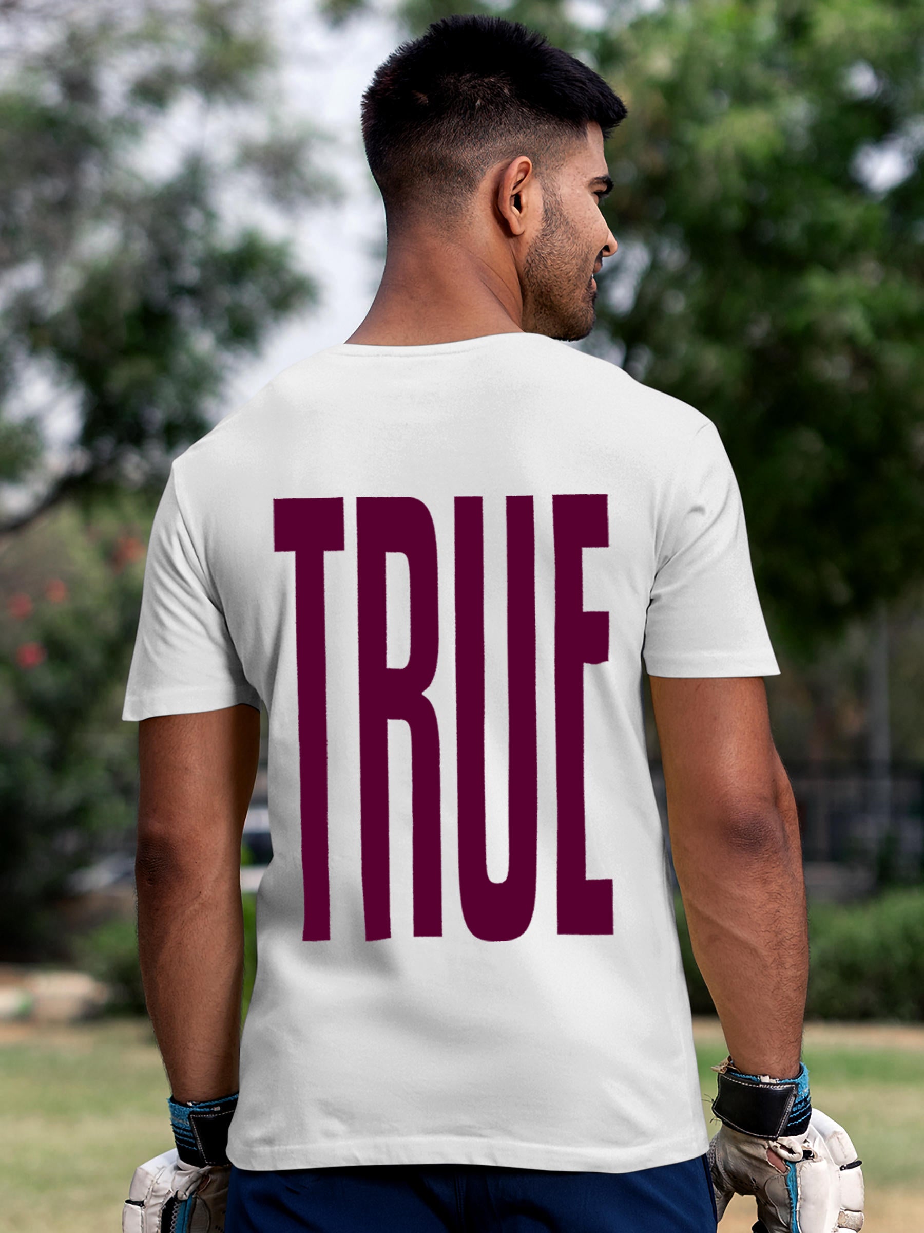 Model wearing Men's White Round Neck T-shirt with 'Truth' design, offering effortless style and premium comfort