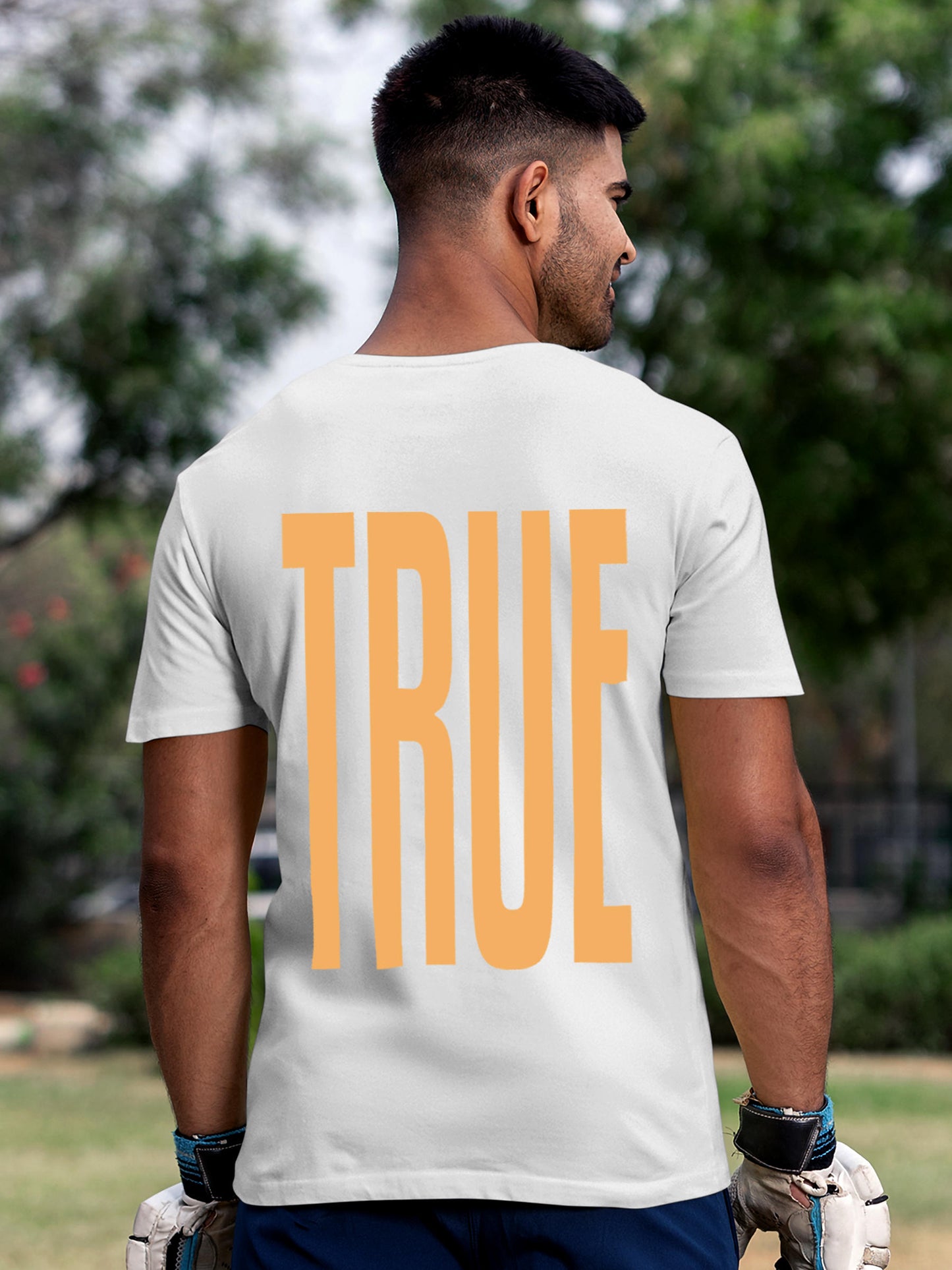 Model wearing Men's White Round Neck T-shirt with 'Truth' design, offering effortless style and premium comfort