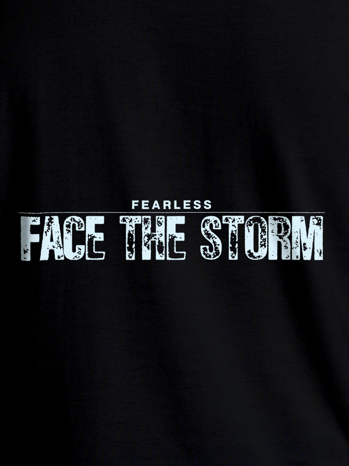 Close up of 'Fearless. Face the Storm' design on Women's Black Round Neck T-shirt, highlighting intricate details and vibrant print.