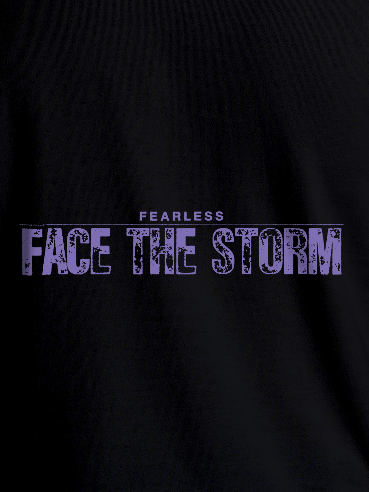 Close up of 'Fearless. Face the Storm' design on Women's Black Round Neck T-shirt, highlighting intricate details and vibrant print.