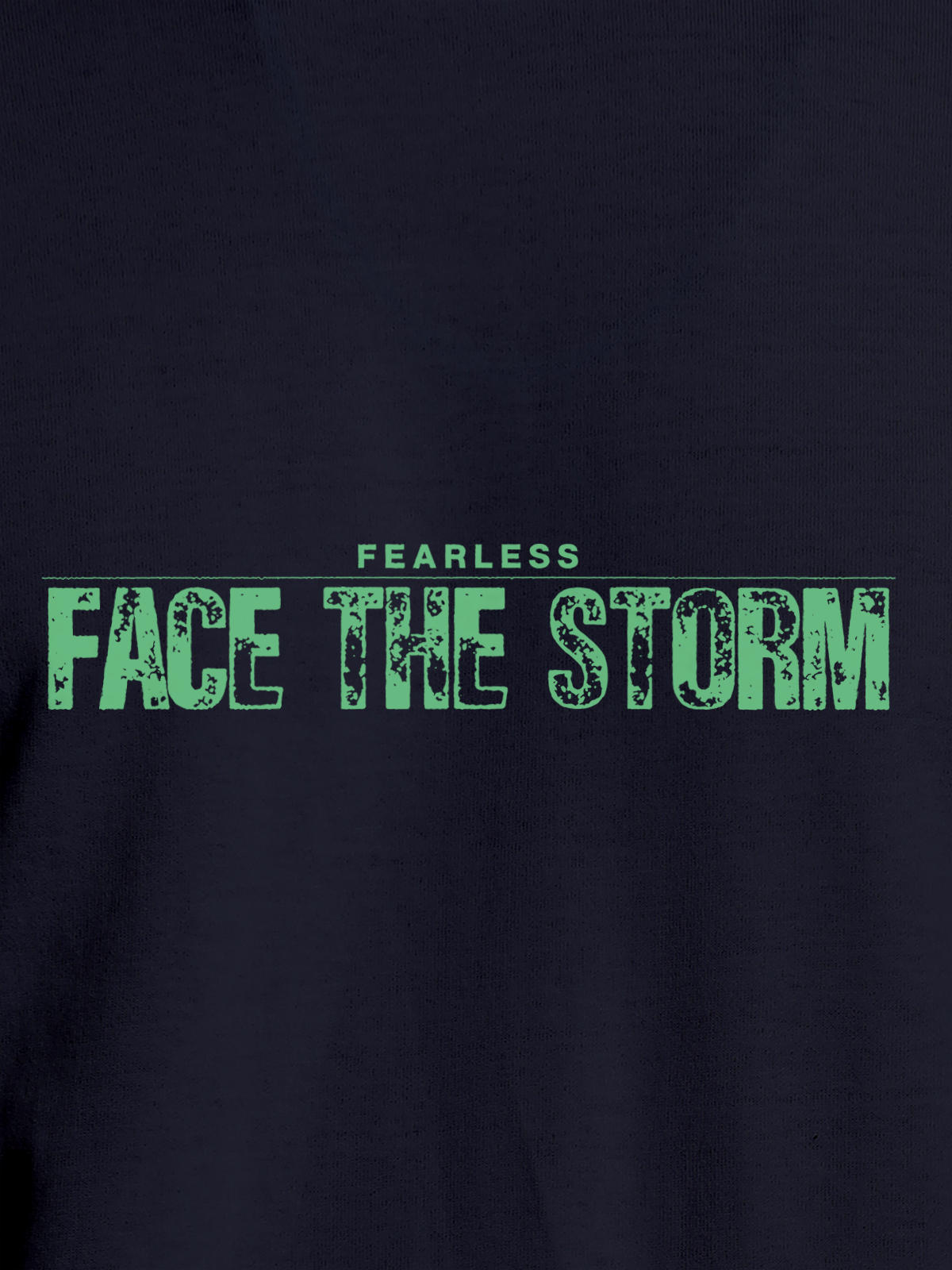 Close up of 'Fearless. Face the Storm' design on Men's Navy Blue Round Neck T-shirt, highlighting intricate details and vibrant print.
