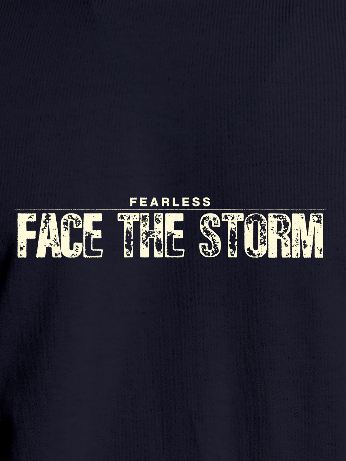 Close up of 'Fearless. Face the Storm' design on Men's Navy Blue Round Neck T-shirt, highlighting intricate details and vibrant print.