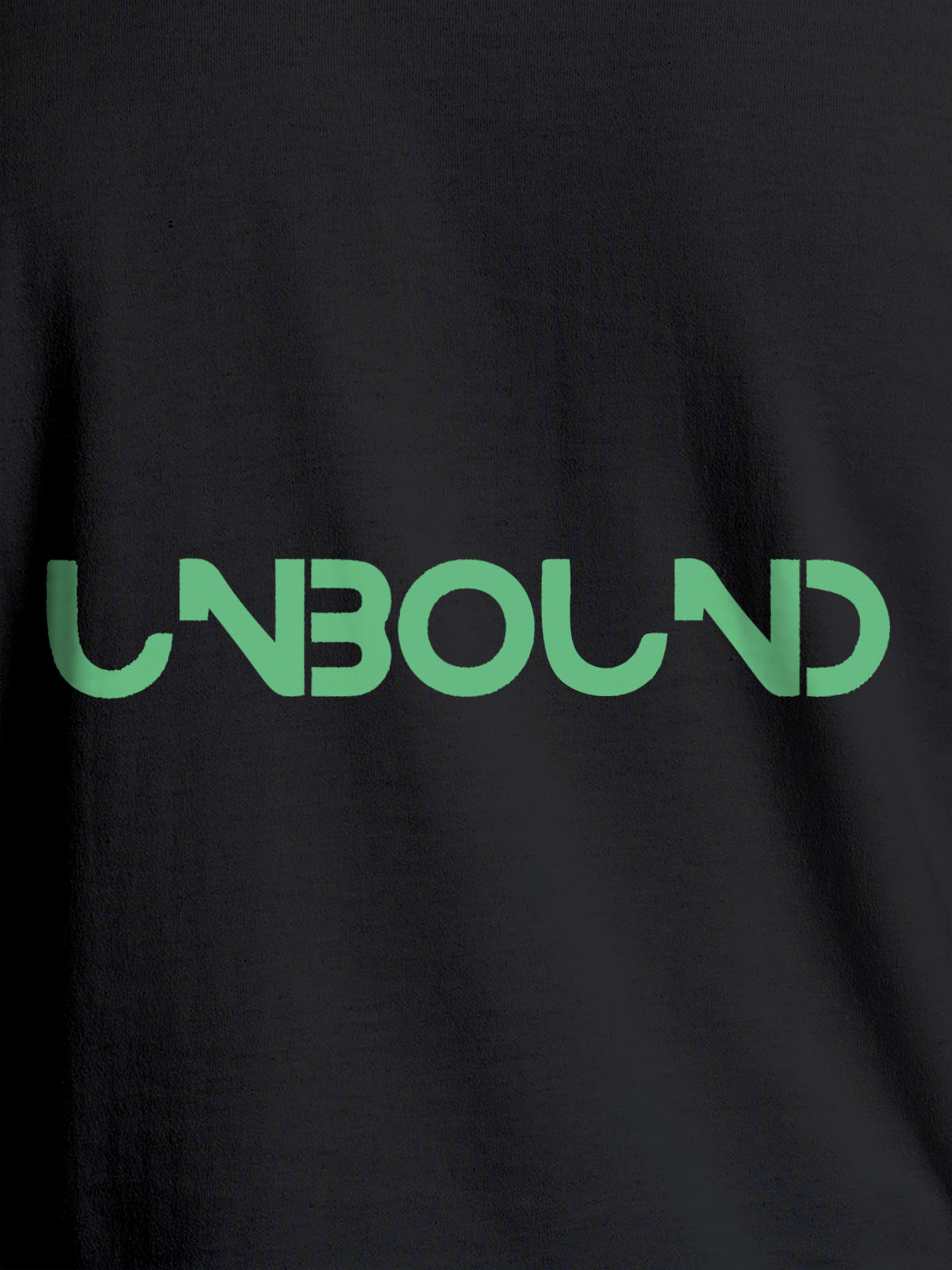 Close up of 'Unbound' design on Men's Dark Grey Round Neck T-shirt, highlighting intricate details and vibrant print.