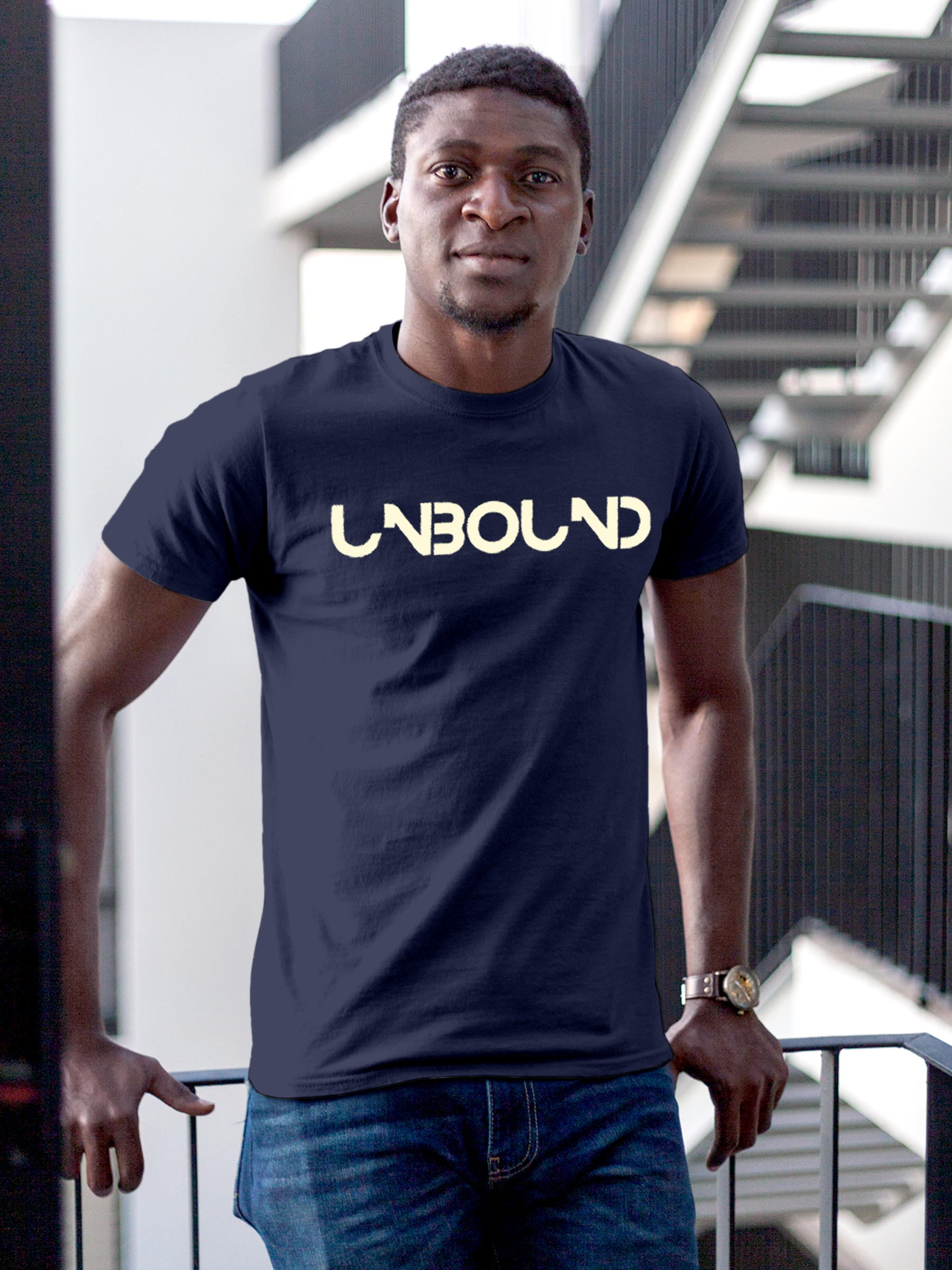 Model wearing Men's Navy Blue Round Neck T-shirt with 'Unbound' design, offering effortless style and premium comfort
