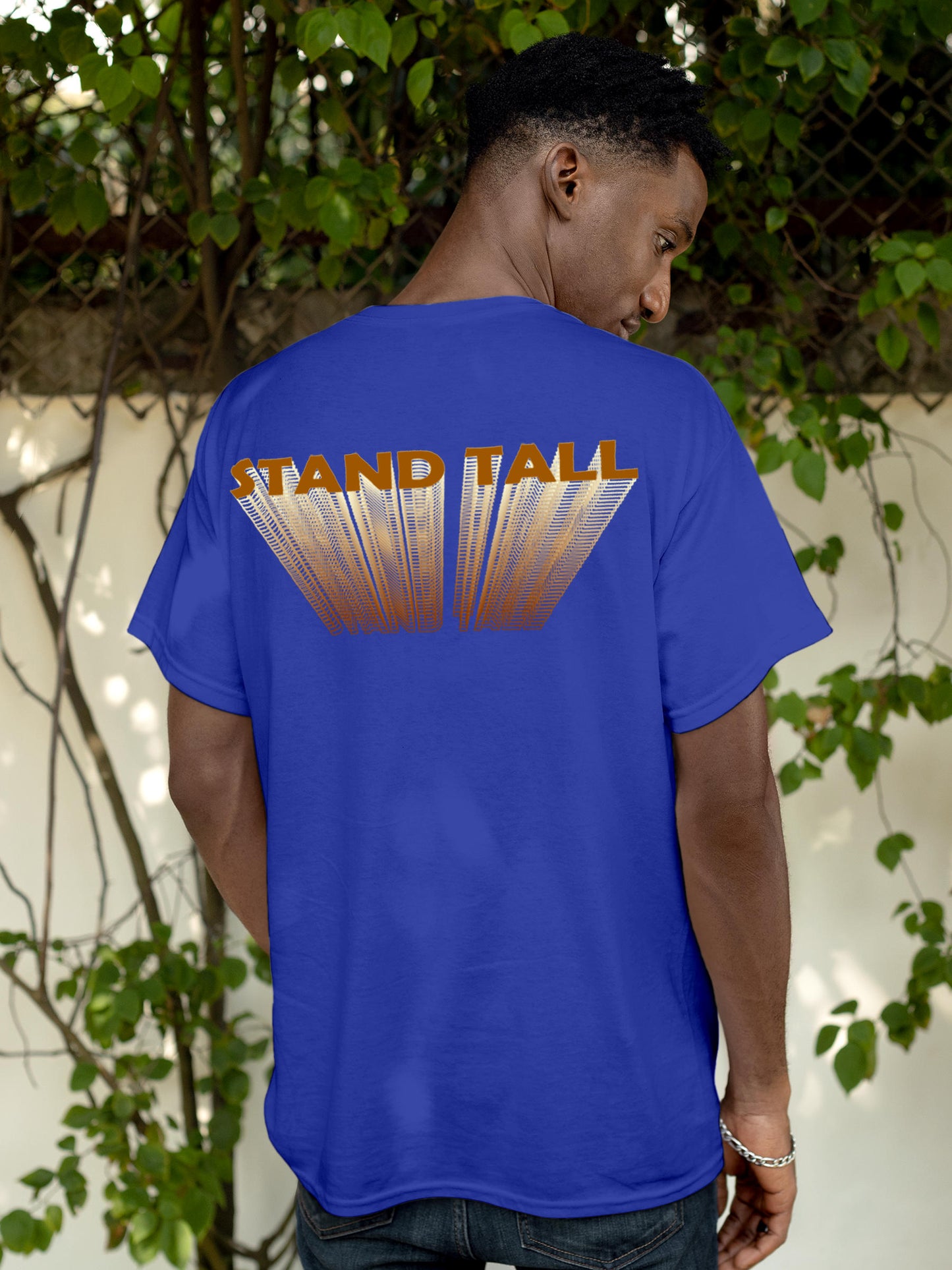 Model wearing Men's Blue Round Neck T-shirt with 'Stand Tall' design, offering effortless style and premium comfort